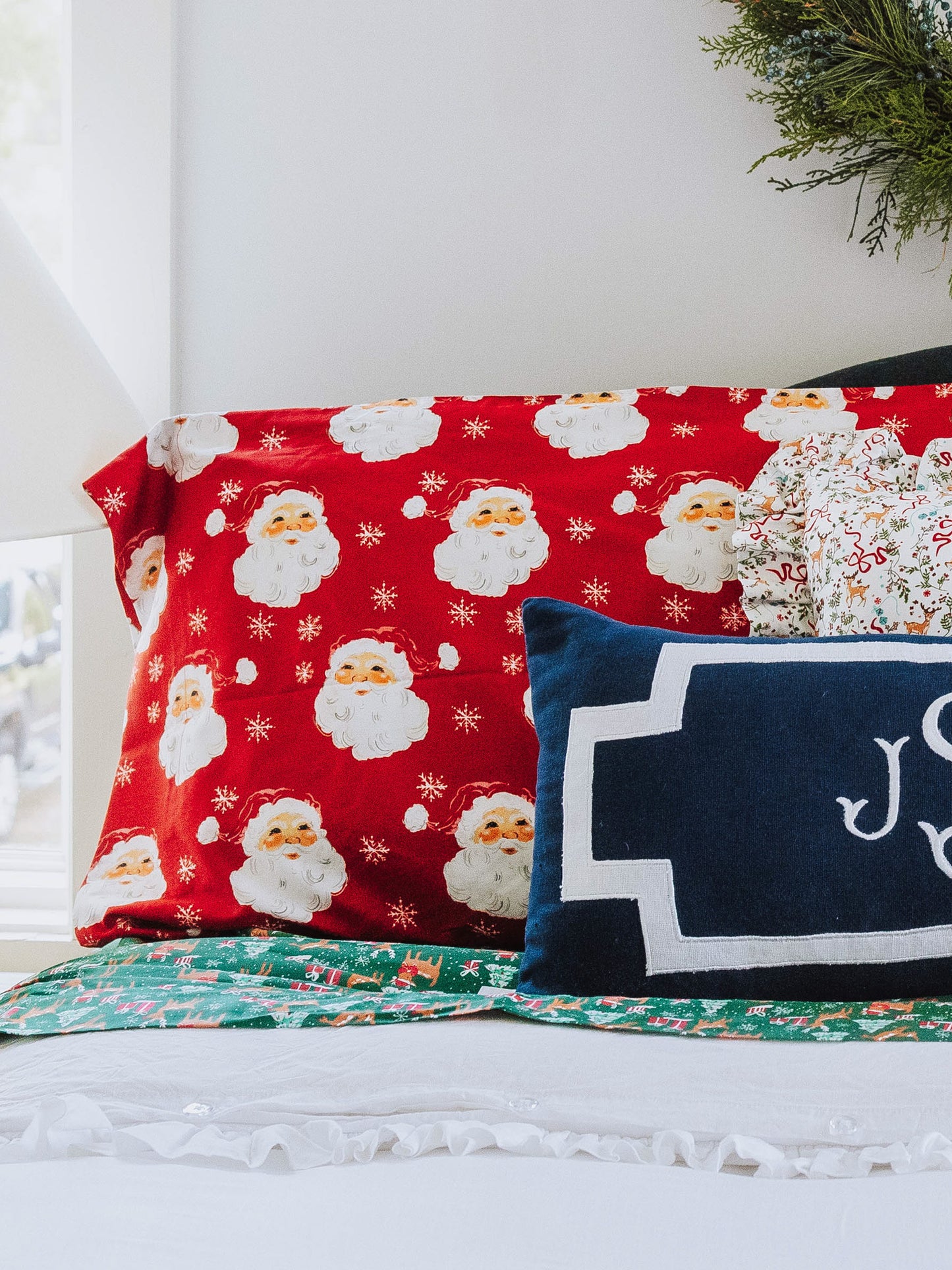 Holiday themed bed with white duvet.