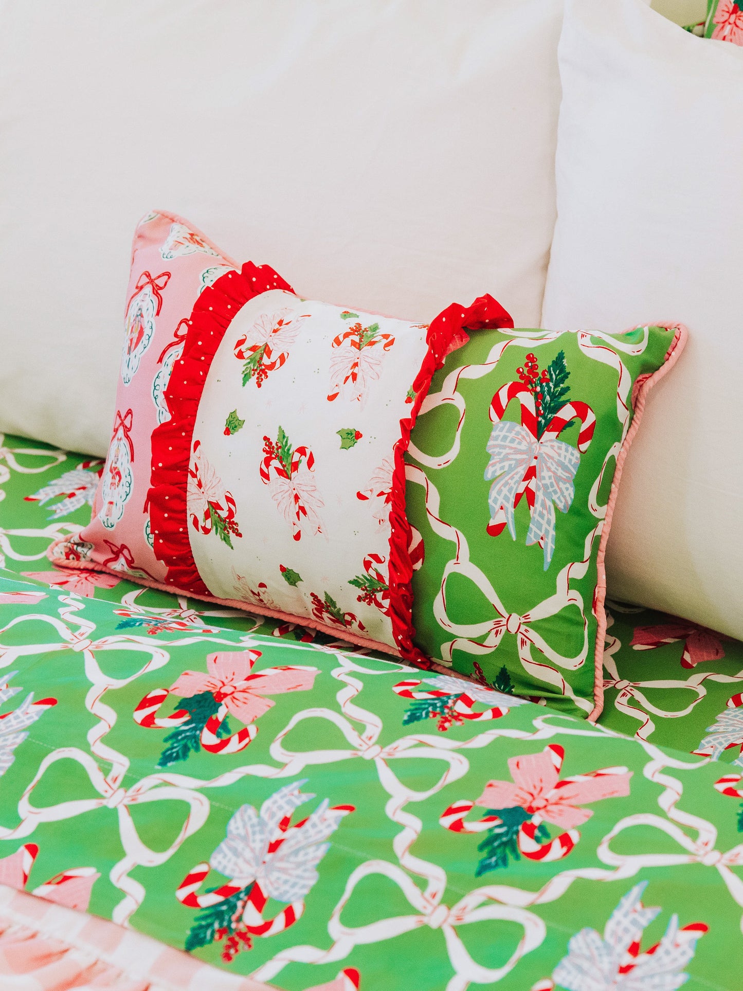 Holiday themed boudoir pillow with matching bedding all around.