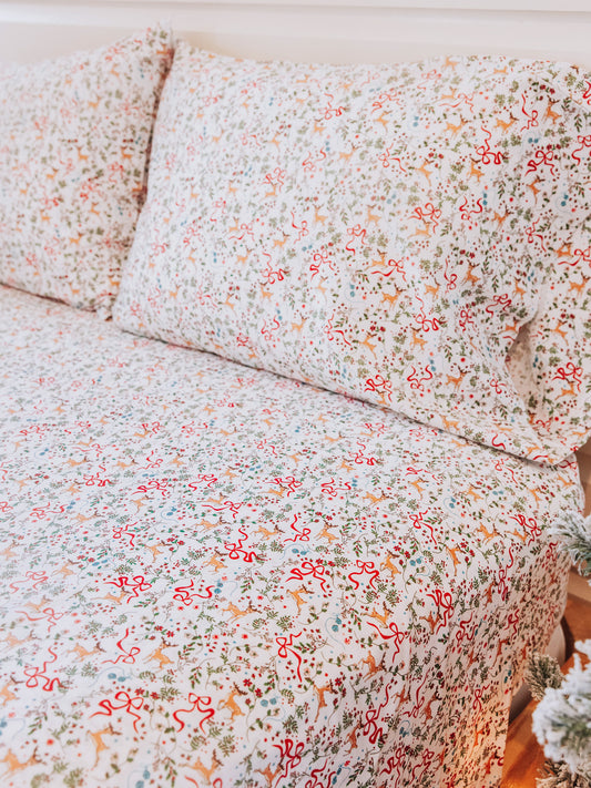 Holiday themed sheet set and matching pillow cases.