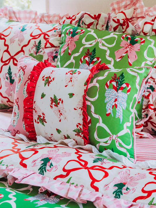 Holiday themed boudoir pillow with matching bedding all around.