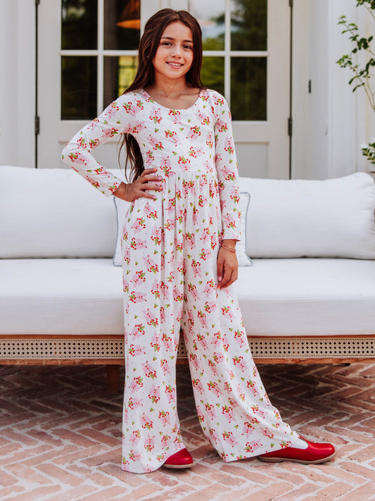 Model wearing a sweet candy cane printed leggy romper.