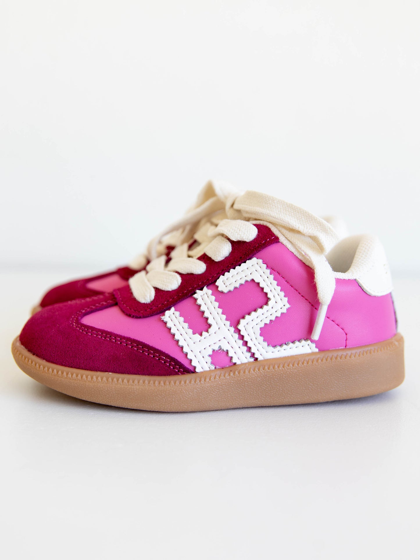 Step into style with our SweetHoney Signature Sneakers! Designed for comfort and play, these adorable girls’ sneakers feature a fun mix of pink and magenta tones with our signature “SH” SweetHoney logo for a bold, playful touch. Crafted with soft materials, sturdy soles, and easy lace-up styling, they’re perfect for school days, adventures, and everyday wear. Combining fashion and function, these sneakers are a must-have for every little trendsetter!