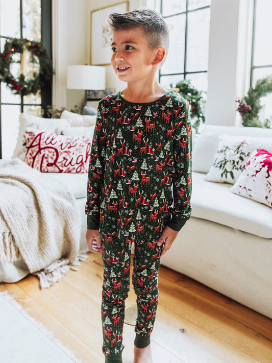 Step into the magic of the season with our Mystic Forest unisex fitted pajamas. Featuring a charming woodland-inspired print with evergreen trees and forest details, this holiday pajama set brings a touch of winter wonder to cozy nights. Made from soft, stretchy fabric for a snug yet comfortable fit, these fitted Christmas pajamas are perfect for lounging, sleeping, or matching family holiday photos.