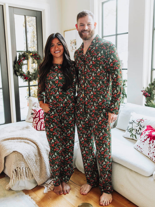 This cozy pajama set features an array of sleighs, Christmas trees, reindeer and more. Perfect for the holidays, this Mystic Forest print brings festive charm and timeless style. Made from a soft, brushed fabric, these holiday plaid pajamas are ideal for cozy mornings, matching family photos, or relaxing by the fire. This family matching Christmas pajama set offers both comfort and classic holiday style you’ll love all season long.
