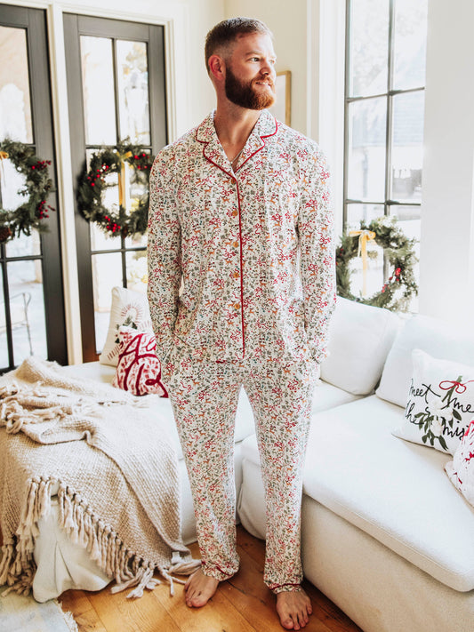 Get cozy in timeless holiday style with our Menโs and Womenโs Holly Jolly Reindeer print. Designed for comfort and classic charm, this two-piece set features a button-down long sleeve top and relaxed-fit pants in a festive pattern that includes bows, reindeer, mistletoes and more. Made from ultra-soft, breathable fabric, itโs perfect for lounging, sleeping, or matching family Christmas mornings.