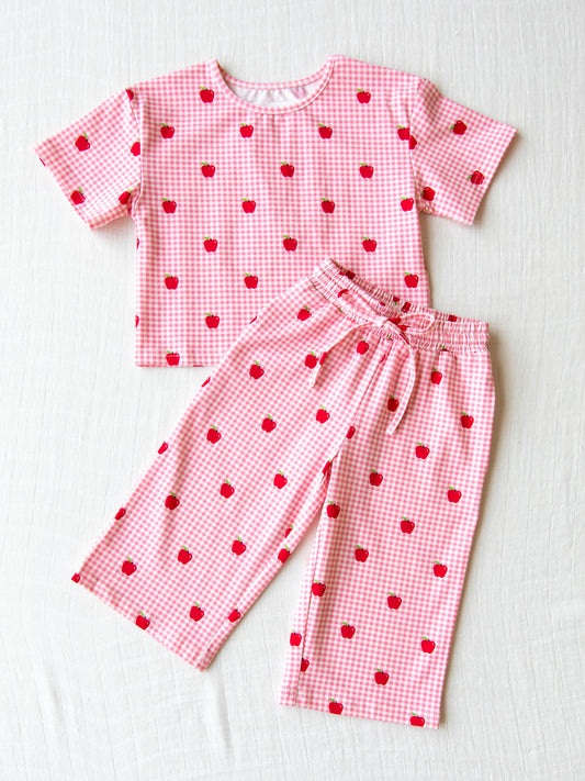 Flat lay of two piece relaxed set in red apple gingham print