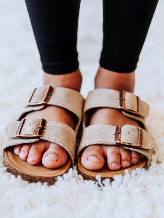 Tan, suede, slip-ons with double buckle clasps.