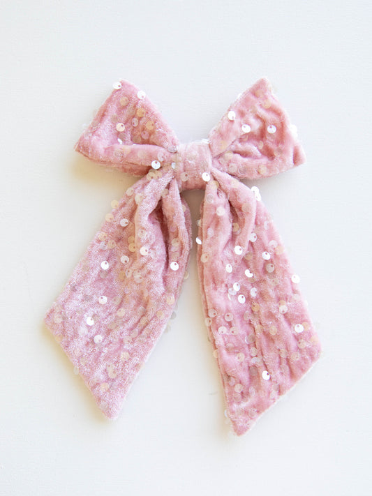 Add a touch of sparkle to every outfit with our girlsโ sequin hair bow! This eye-catching accessory shines with shimmering sequins that glisten beautifully in the light. Designed with a secure alligator clip for easy styling, itโs perfect for holiday parties, special occasions, and everyday sparkle. Pair it with her favorite dress or festive outfit for the ultimate finishing touch!
