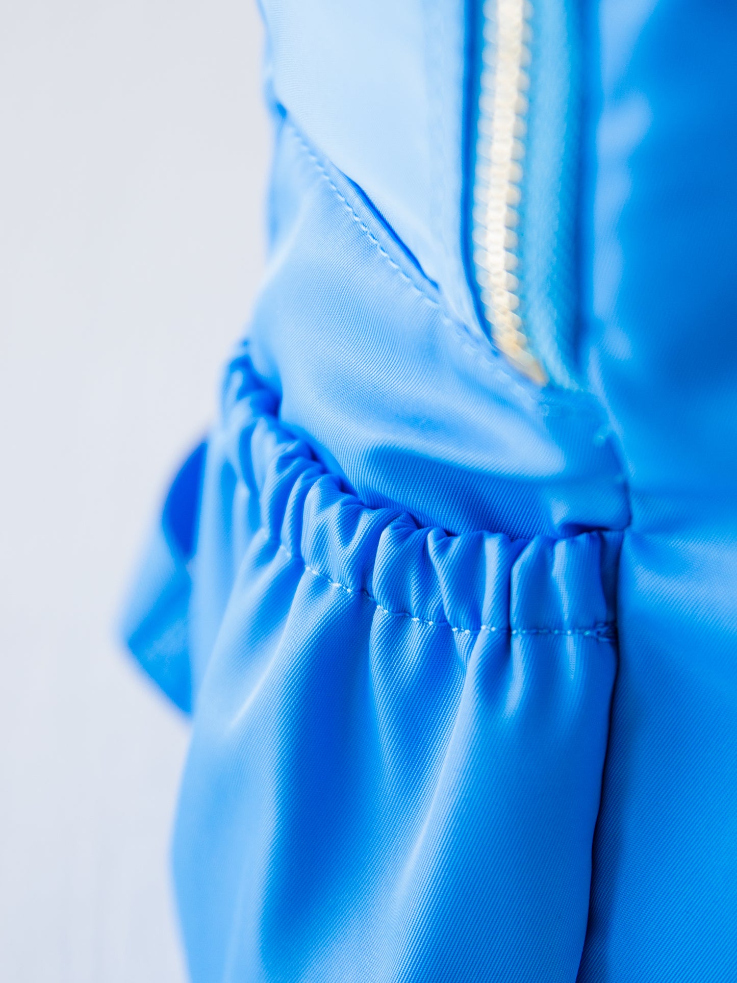 Picture of side pocket of blue backpack