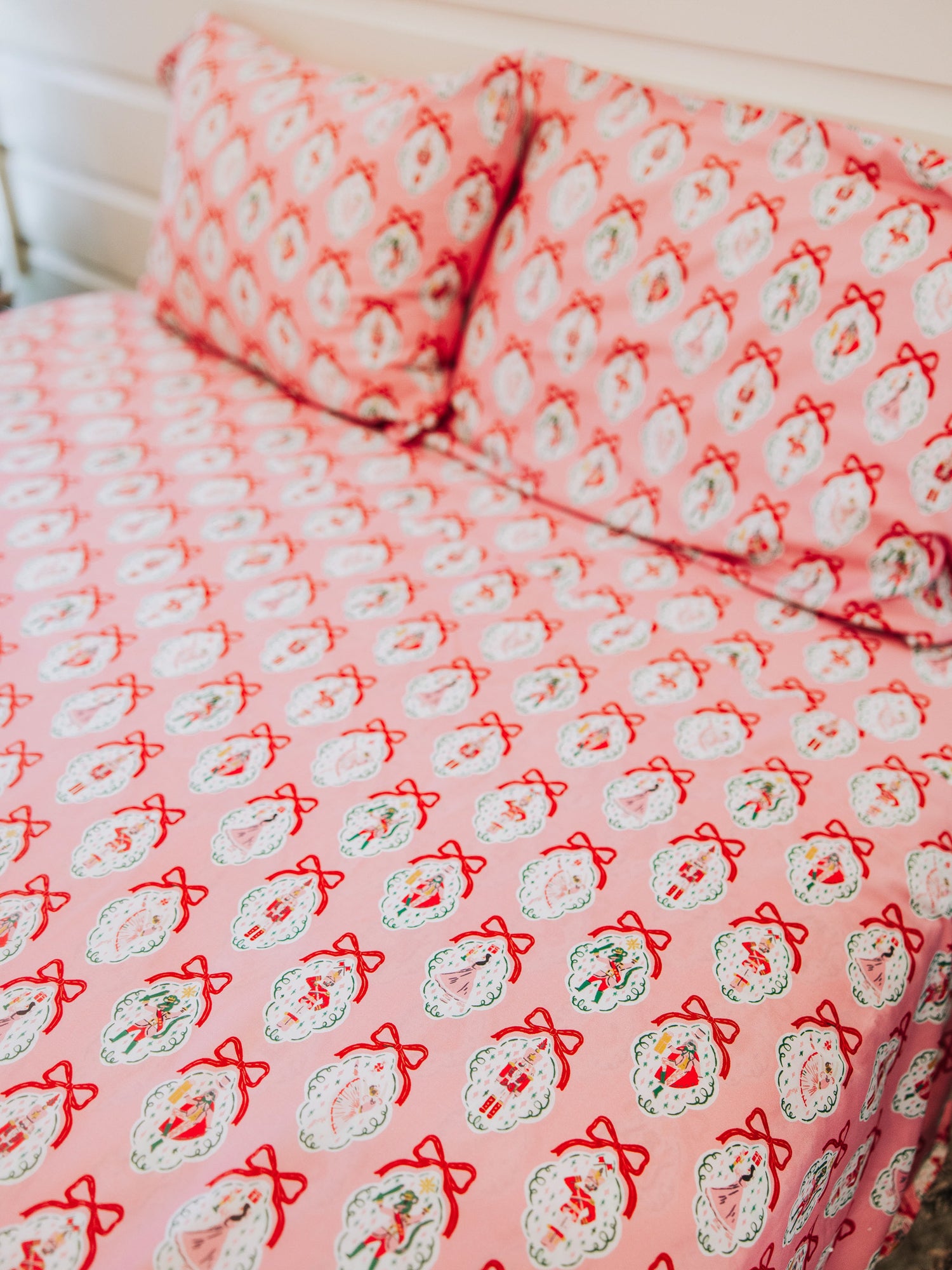 Pink nutcracker sheet set and pillow cases shown. 