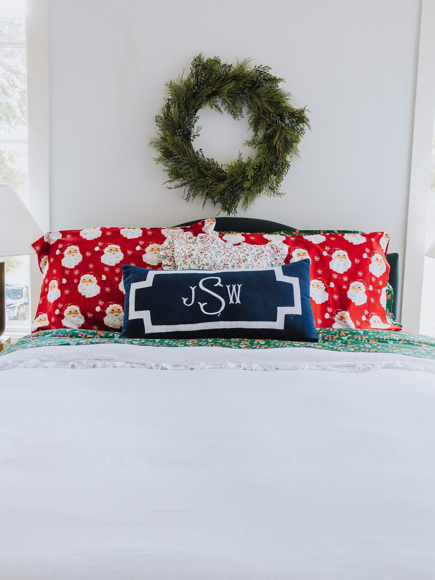 Holiday themed made up bed with plain white duvet. 