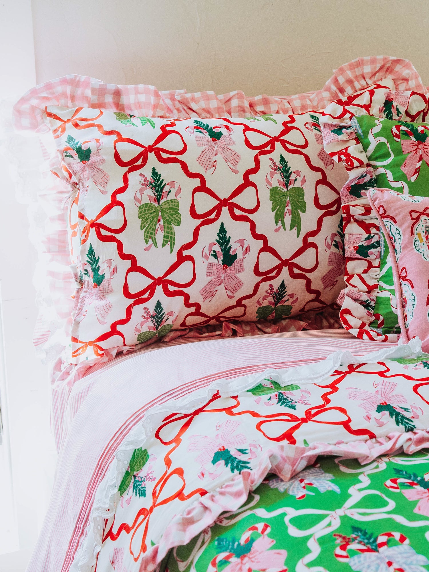 Christmas themed bedding with up close picture of matching pillow. 