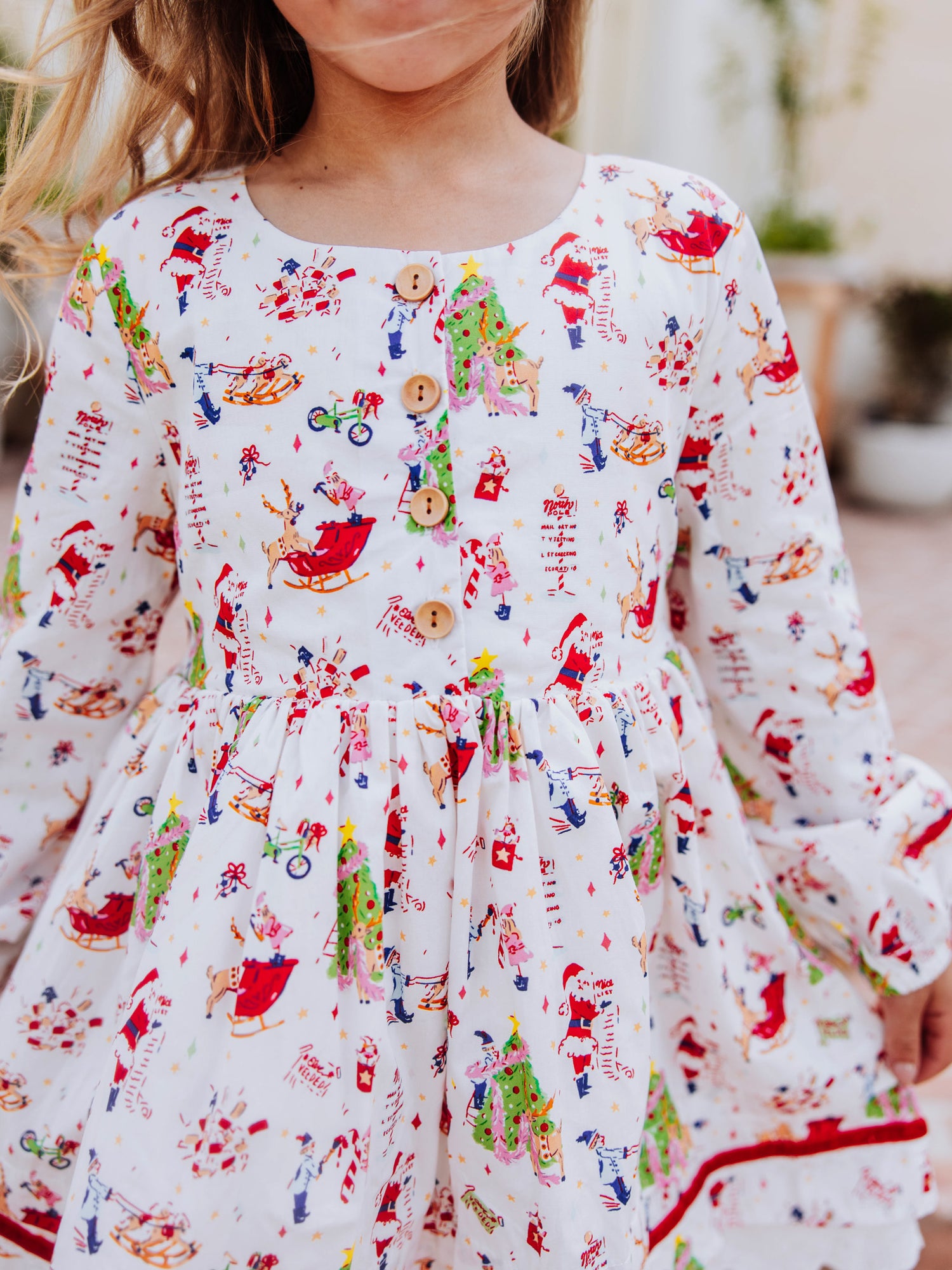 Up close shot of the buttons on bodice of holiday themed dress.