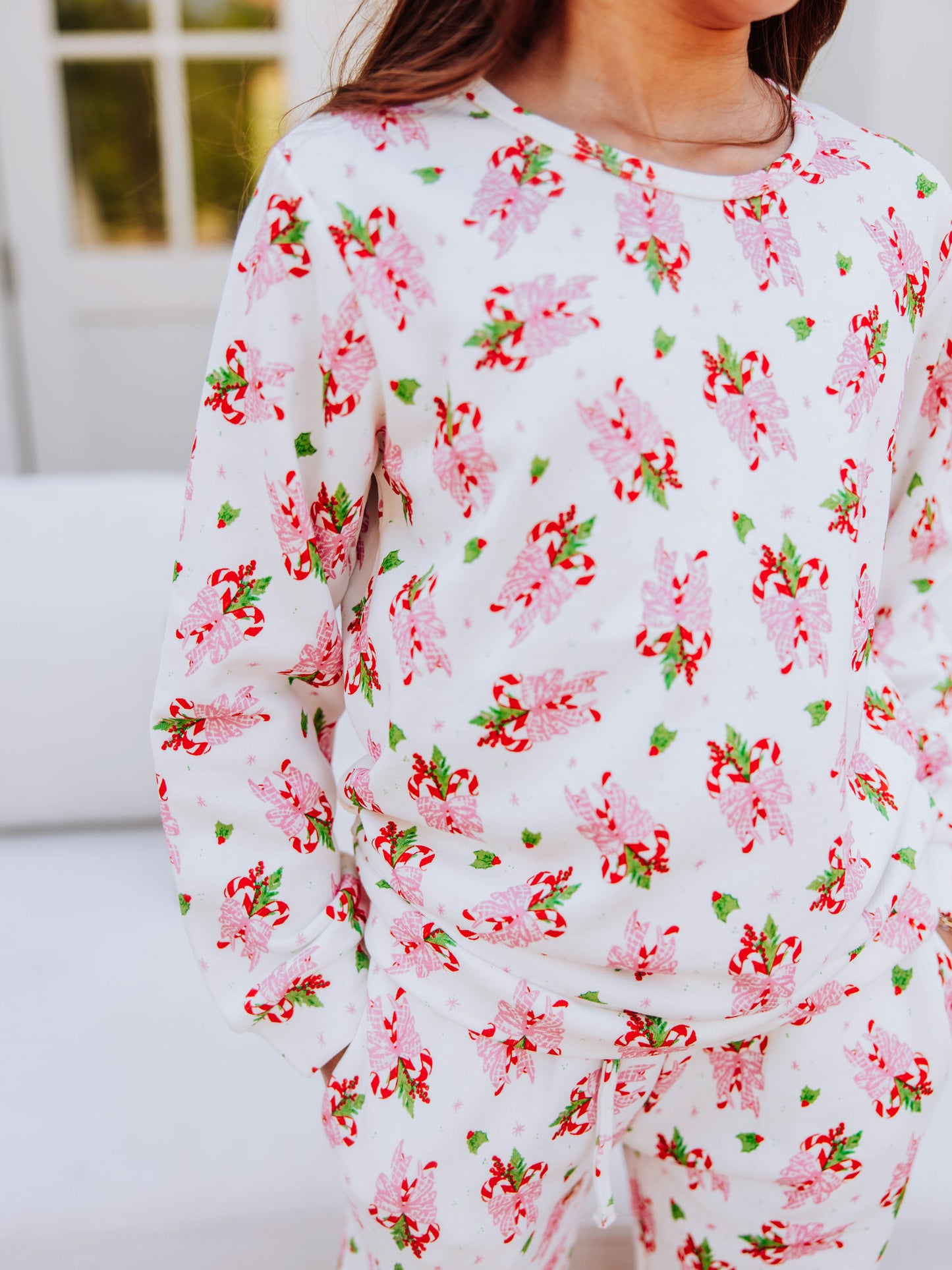 Up close pic of sweet candy cane print on sweatshirt set. 