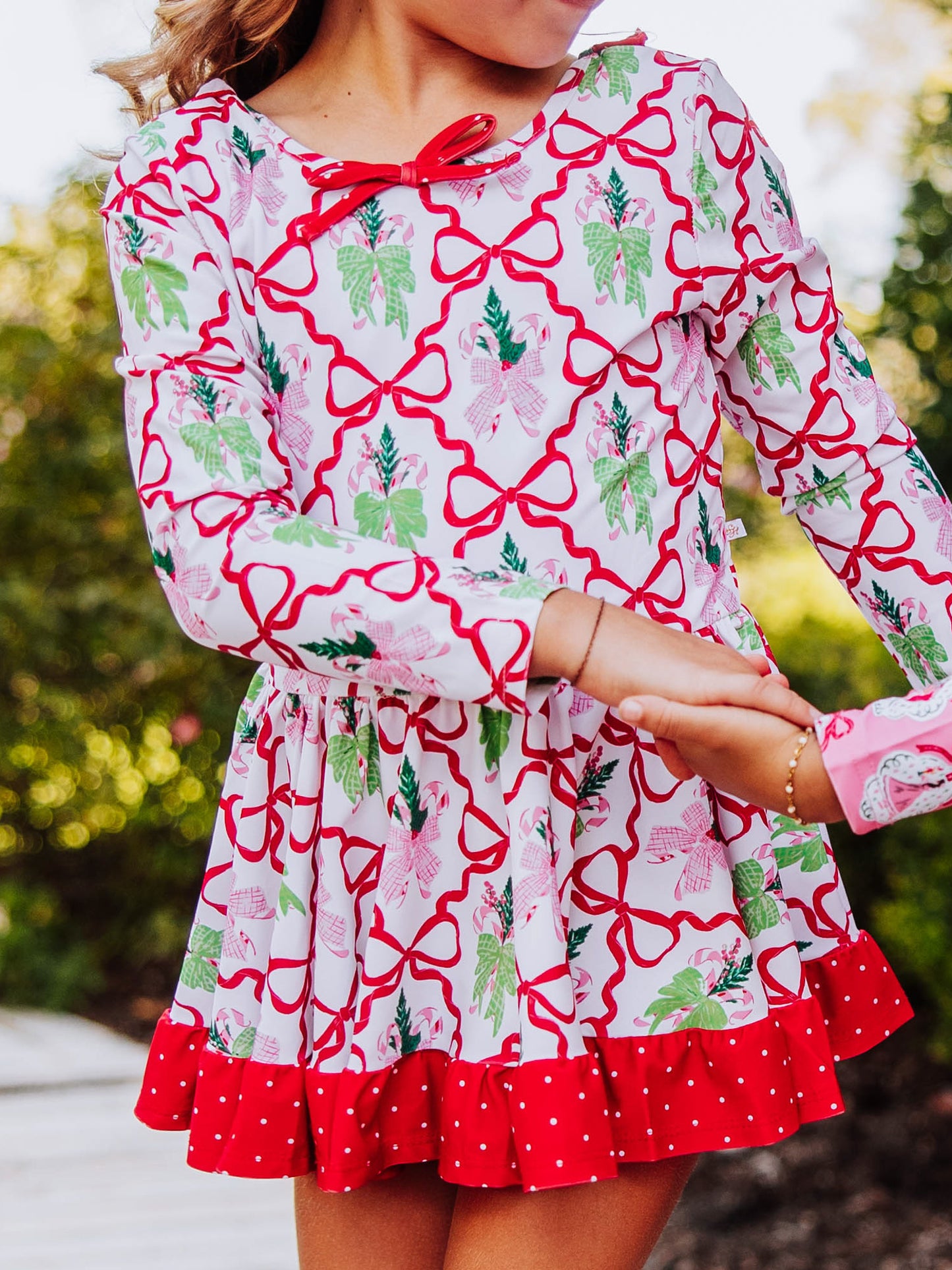 Up close shot of a girl wearing a holiday themed skirted leotard. 