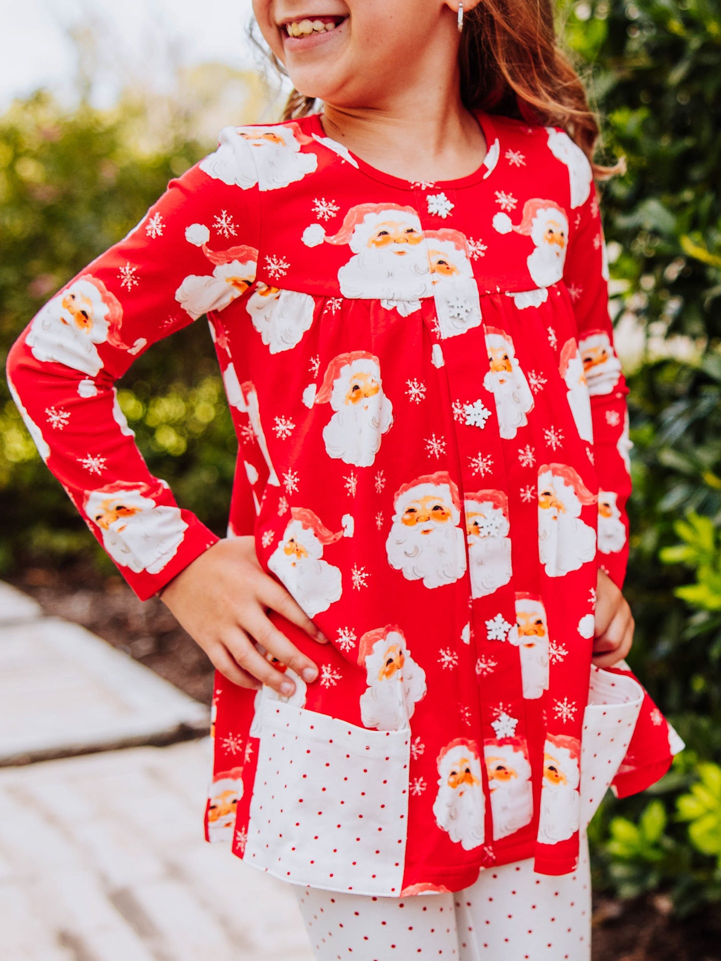 Girl wearing a jolly santa printed out to play set