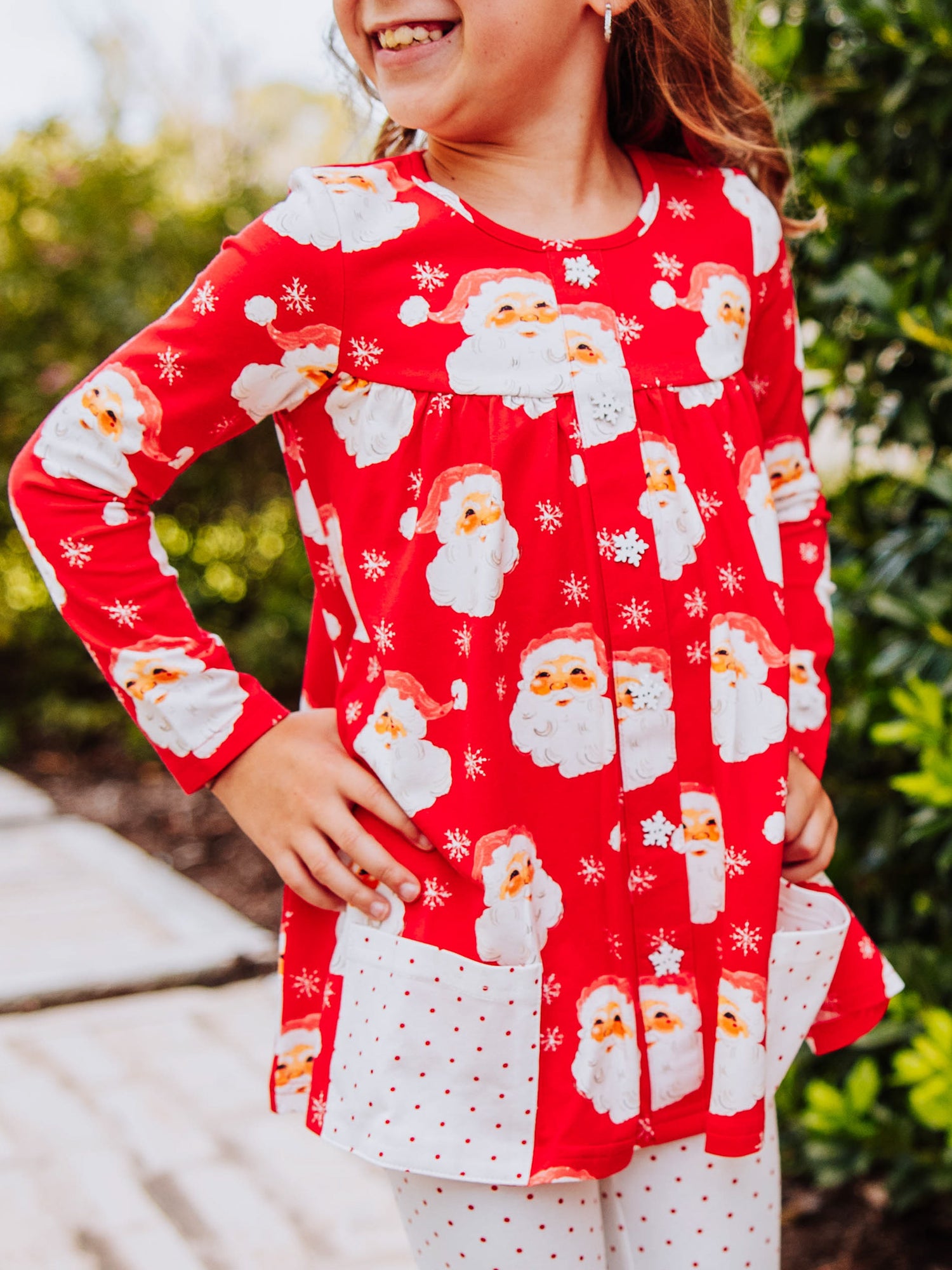 Girl wearing a jolly santa printed out to play set