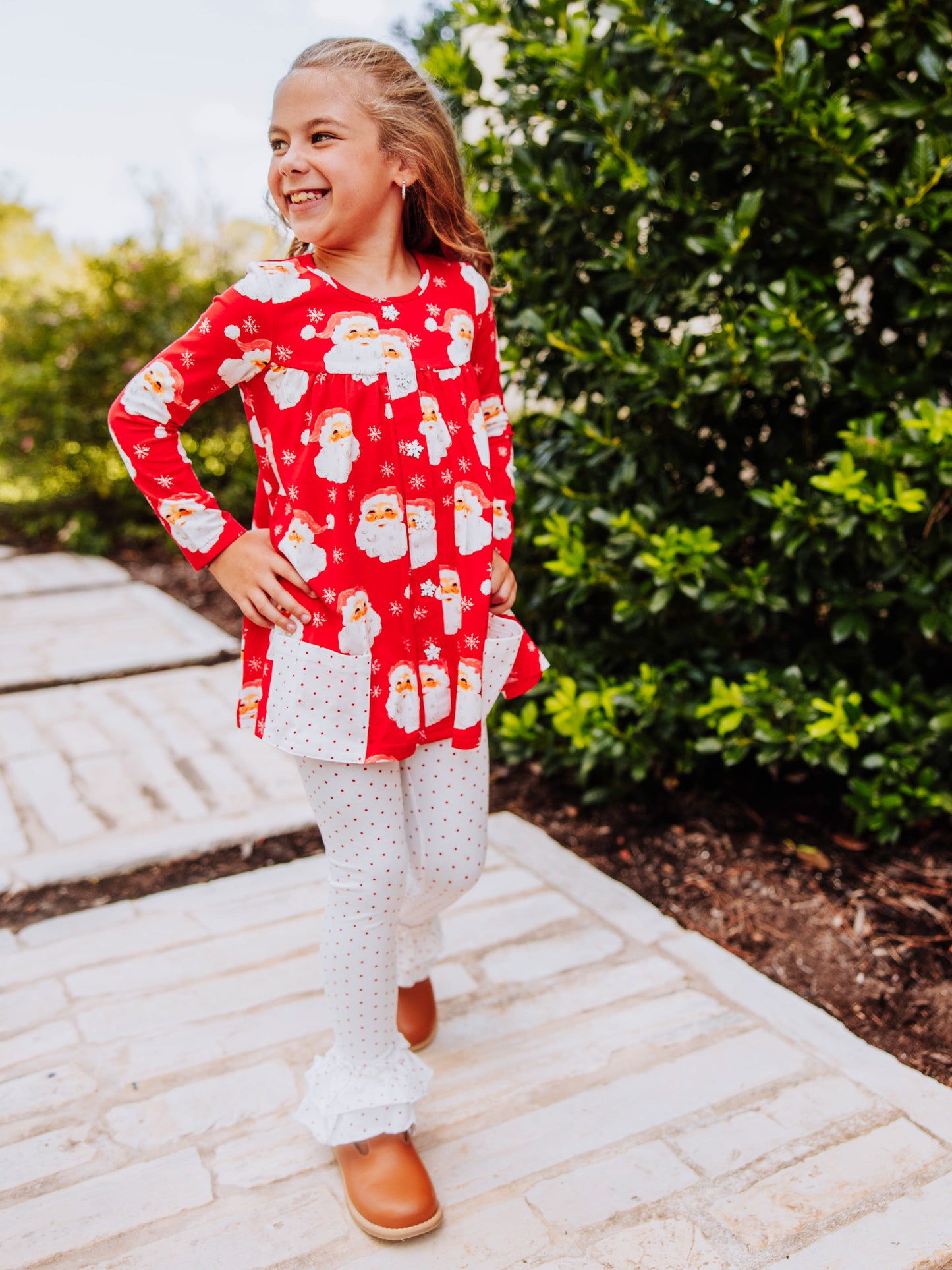 Girl wearing a jolly santa printed out to play set