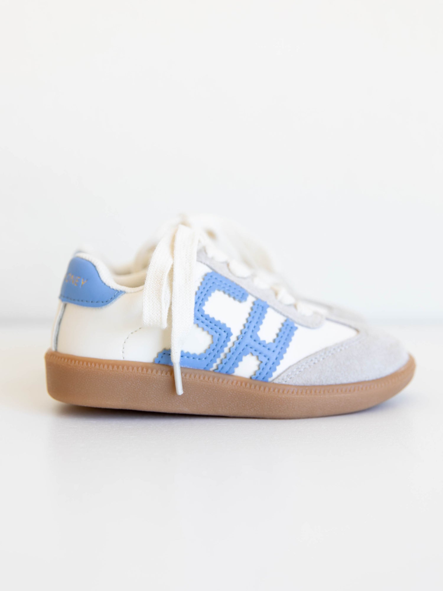 Fresh, fun, and full of SweetHoney style — our Signature Sneakers in dusty blue and white are the perfect mix of comfort and charm! Featuring our bold “SH” SweetHoney logo, soft suede accents, and durable gum soles, these boutique kids’ sneakers are designed for everyday adventures. Whether paired with twirl dresses or playtime outfits, they’re the ultimate blend of fashion and function for little trendsetters on the go.