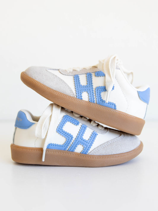 Fresh, fun, and full of SweetHoney style — our Signature Sneakers in dusty blue and white are the perfect mix of comfort and charm! Featuring our bold “SH” SweetHoney logo, soft suede accents, and durable gum soles, these boutique kids’ sneakers are designed for everyday adventures. Whether paired with twirl dresses or playtime outfits, they’re the ultimate blend of fashion and function for little trendsetters on the go.