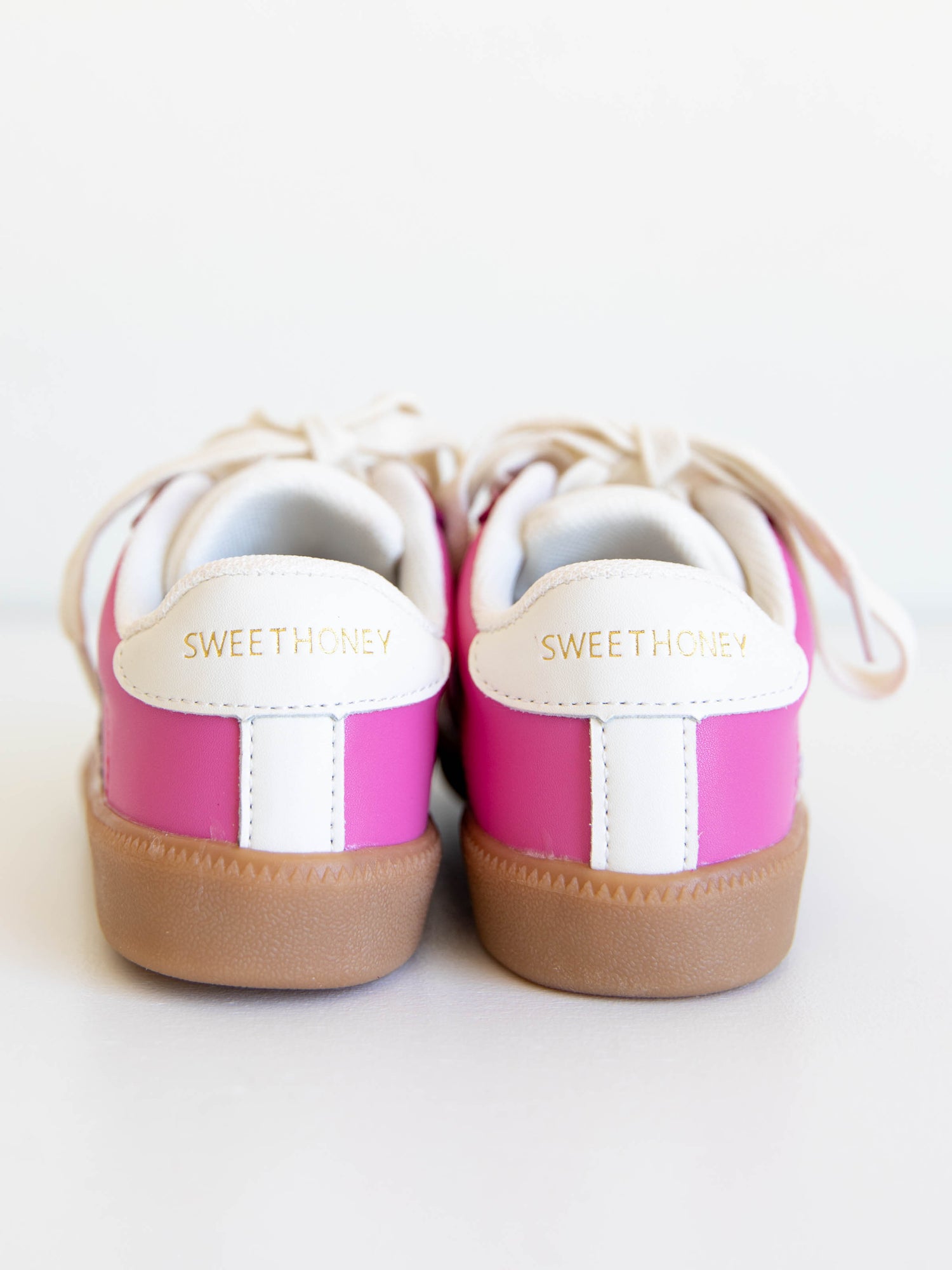 Step into style with our SweetHoney Signature Sneakers! Designed for comfort and play, these adorable girls’ sneakers feature a fun mix of pink and magenta tones with our signature “SH” SweetHoney logo for a bold, playful touch. Crafted with soft materials, sturdy soles, and easy lace-up styling, they’re perfect for school days, adventures, and everyday wear. Combining fashion and function, these sneakers are a must-have for every little trendsetter!