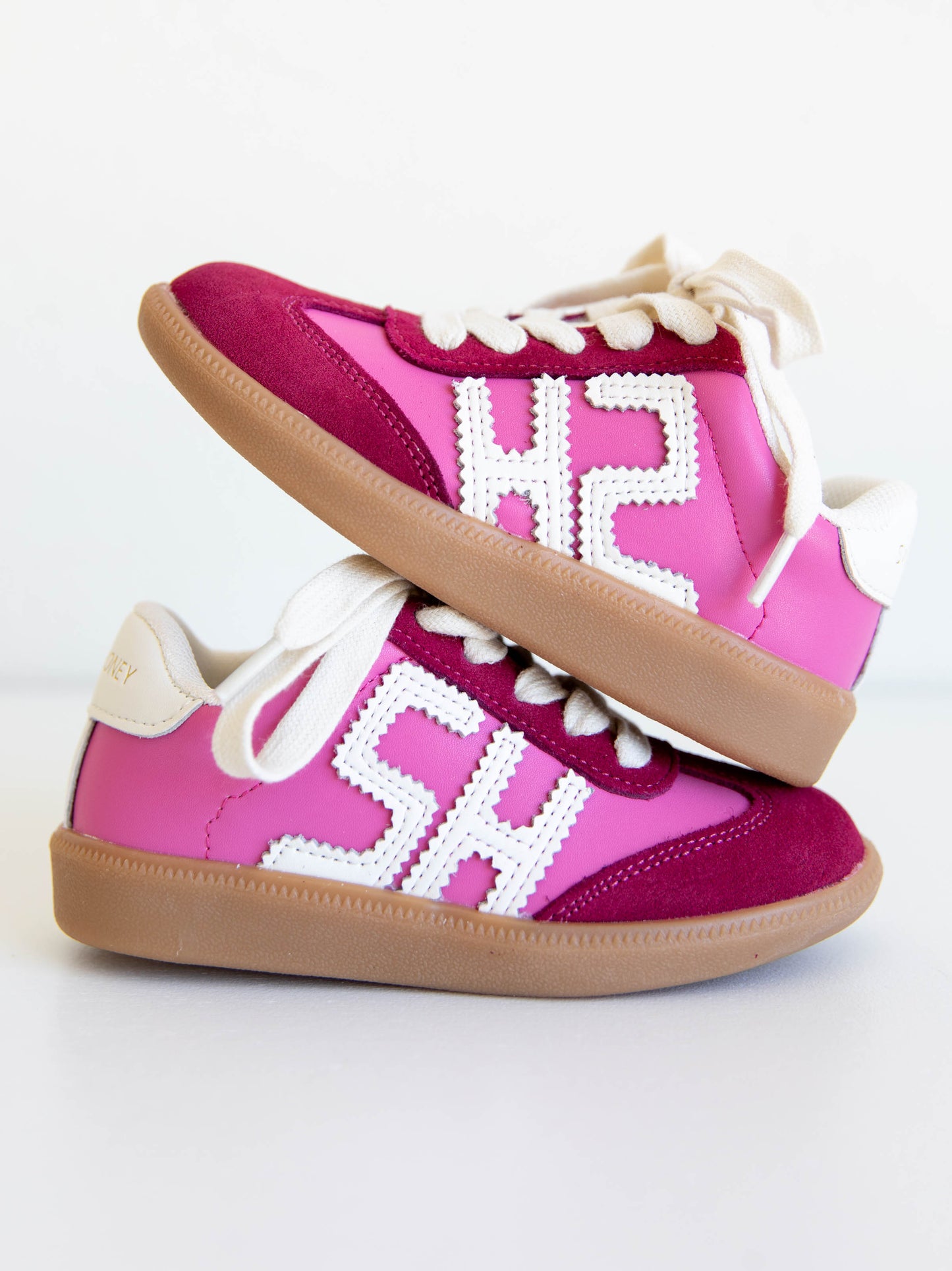 Step into style with our SweetHoney Signature Sneakers! Designed for comfort and play, these adorable girls’ sneakers feature a fun mix of pink and red tones with our signature “SH” SweetHoney logo for a bold, playful touch. Crafted with soft materials, sturdy soles, and easy lace-up styling, they’re perfect for school days, adventures, and everyday wear. Combining fashion and function, these sneakers are a must-have for every little trendsetter!