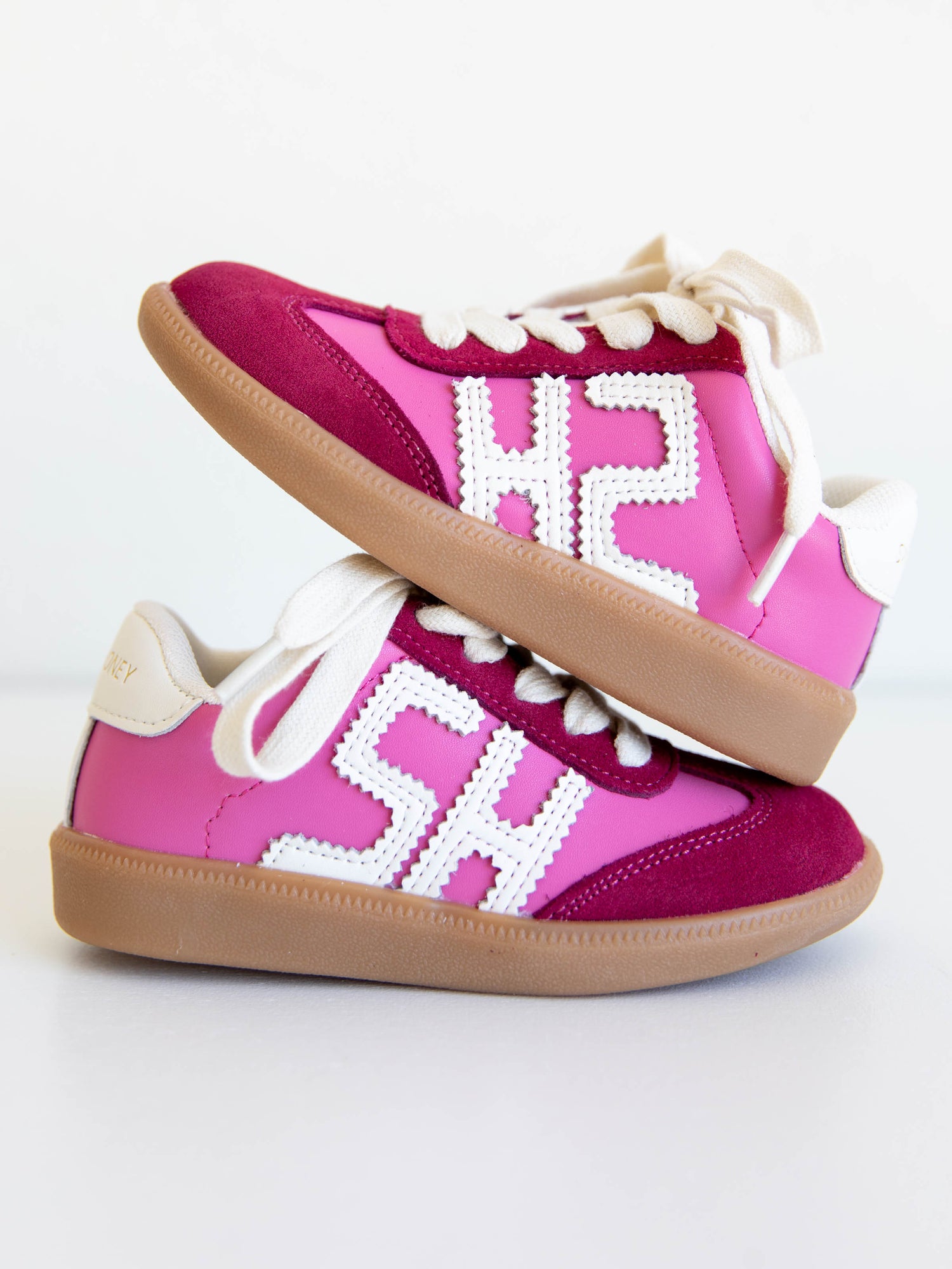 Step into style with our SweetHoney Signature Sneakers! Designed for comfort and play, these adorable girls’ sneakers feature a fun mix of pink and red tones with our signature “SH” SweetHoney logo for a bold, playful touch. Crafted with soft materials, sturdy soles, and easy lace-up styling, they’re perfect for school days, adventures, and everyday wear. Combining fashion and function, these sneakers are a must-have for every little trendsetter!