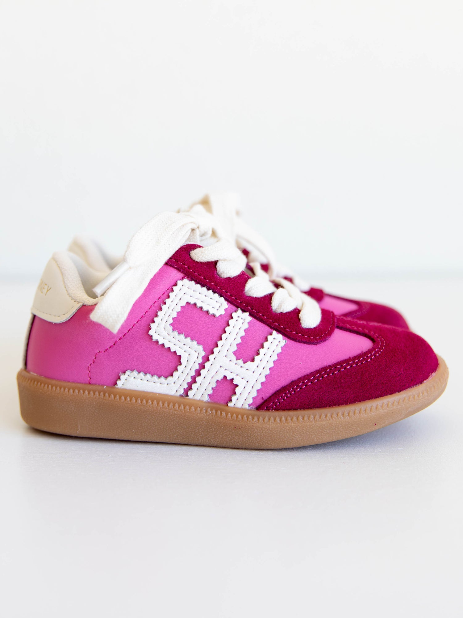 Step into style with our SweetHoney Signature Sneakers! Designed for comfort and play, these adorable girls’ sneakers feature a fun mix of pink and magenta tones with our signature “SH” SweetHoney logo for a bold, playful touch. Crafted with soft materials, sturdy soles, and easy lace-up styling, they’re perfect for school days, adventures, and everyday wear. Combining fashion and function, these sneakers are a must-have for every little trendsetter!