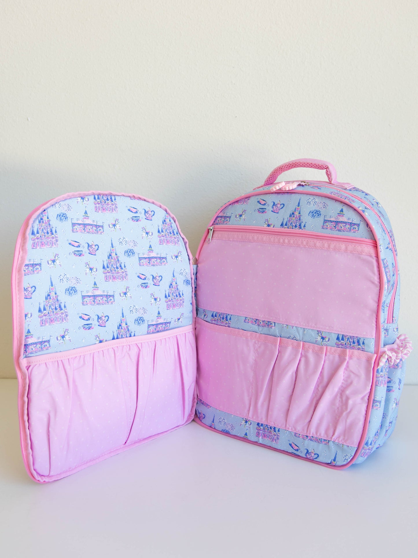 Bring the magic wherever you go with SweetHoney's Most Magical Backpack — a whimsical essential for school days, travel adventures, and every little outing in between! Designed in our signature Most Magical print, this backpack features charming pastel castles, carriages, and fairytale-inspired details that spark imagination and joy. Crafted from durable, easy-to-clean material, it’s built to last through every adventure. 