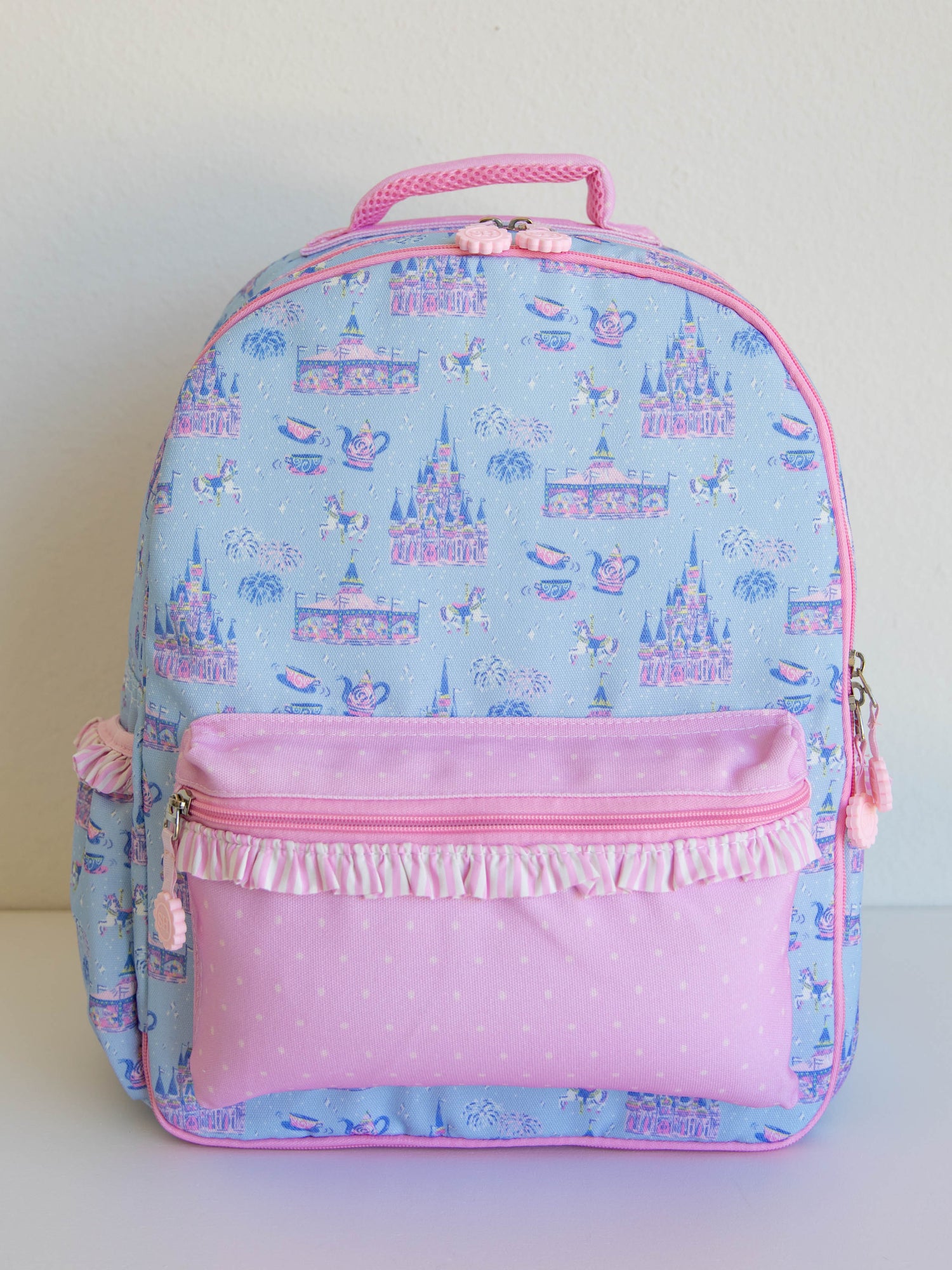 Bring the magic wherever you go with SweetHoney's Most Magical Backpack — a whimsical essential for school days, travel adventures, and every little outing in between! Designed in our signature Most Magical print, this backpack features charming pastel castles, carriages, and fairytale-inspired details that spark imagination and joy. Crafted from durable, easy-to-clean material, it’s built to last through every adventure. 