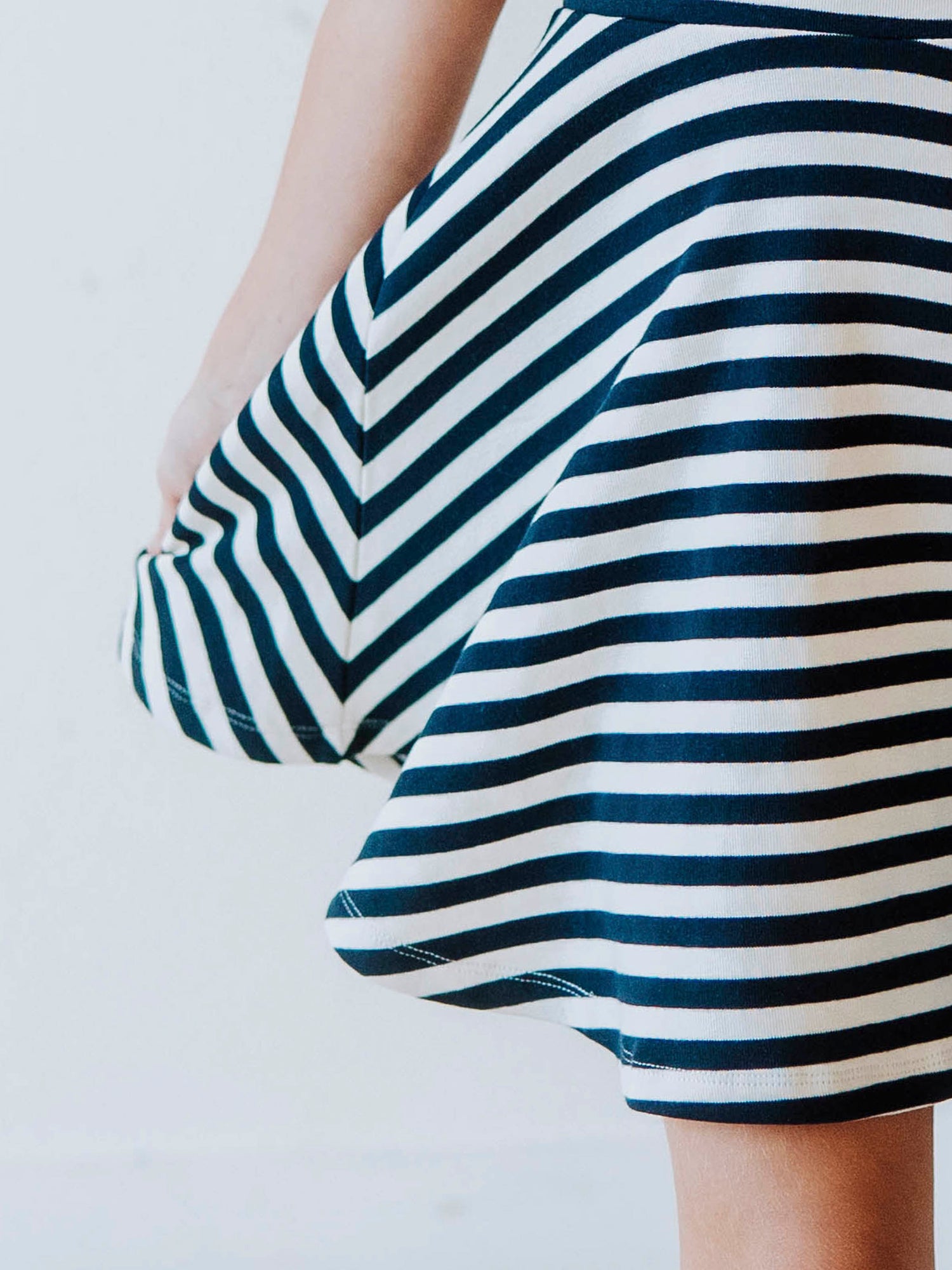 Close up of navy and striped dress