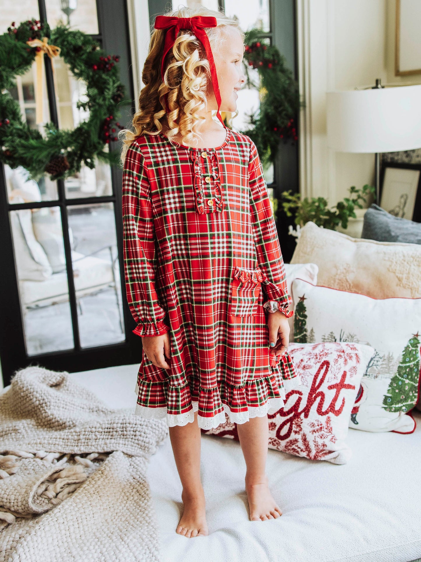This merry plaid dress for girls features a timeless red, white, and green tartan pattern that’s perfect for the holiday season. Designed with classic charm and sweet details, this girls’ plaid Christmas dress is ideal for family photos, lounge and play. The soft, lightweight fabric ensures all-day comfort, while the twirl-worthy skirt adds a playful touch. A must-have addition to her holiday wardrobe!