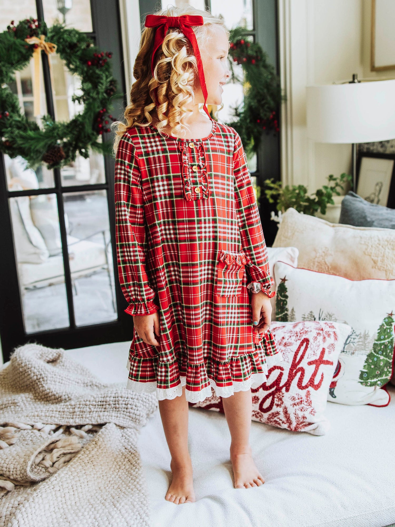 This merry plaid dress for girls features a timeless red, white, and green tartan pattern that’s perfect for the holiday season. Designed with classic charm and sweet details, this girls’ plaid Christmas dress is ideal for family photos, lounge and play. The soft, lightweight fabric ensures all-day comfort, while the twirl-worthy skirt adds a playful touch. A must-have addition to her holiday wardrobe!