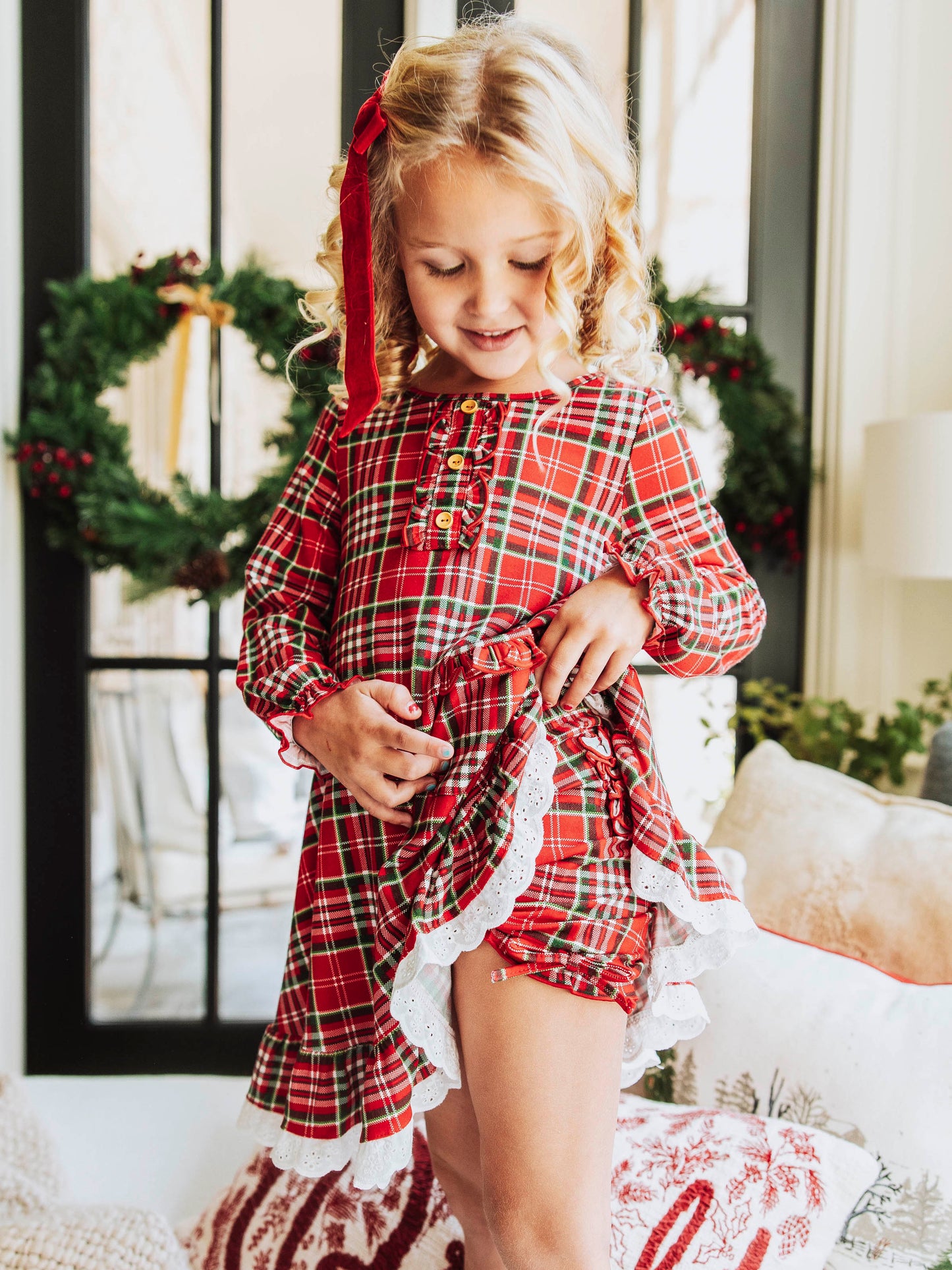 This merry plaid dress for girls features a timeless red, white, and green tartan pattern that’s perfect for the holiday season. Designed with classic charm and sweet details, this girls’ plaid Christmas dress is ideal for family photos, lounge and play. The soft, lightweight fabric ensures all-day comfort, while the twirl-worthy skirt adds a playful touch. A must-have addition to her holiday wardrobe!