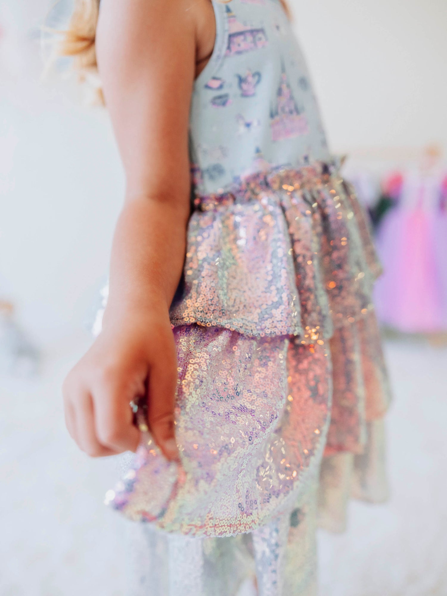 Make every day feel like a fairytale in our Most Magical Tiered Sparkle Dress! This enchanting girls’ dress features our signature “Most Magical” print bodice — filled with dreamy castles, carousels, and whimsical details — paired with a tiered iridescent sequin skirt that shimmers with every twirl. Designed for comfort and style, it’s perfect for holiday photos, birthday parties, or any moment that calls for a little extra sparkle. 