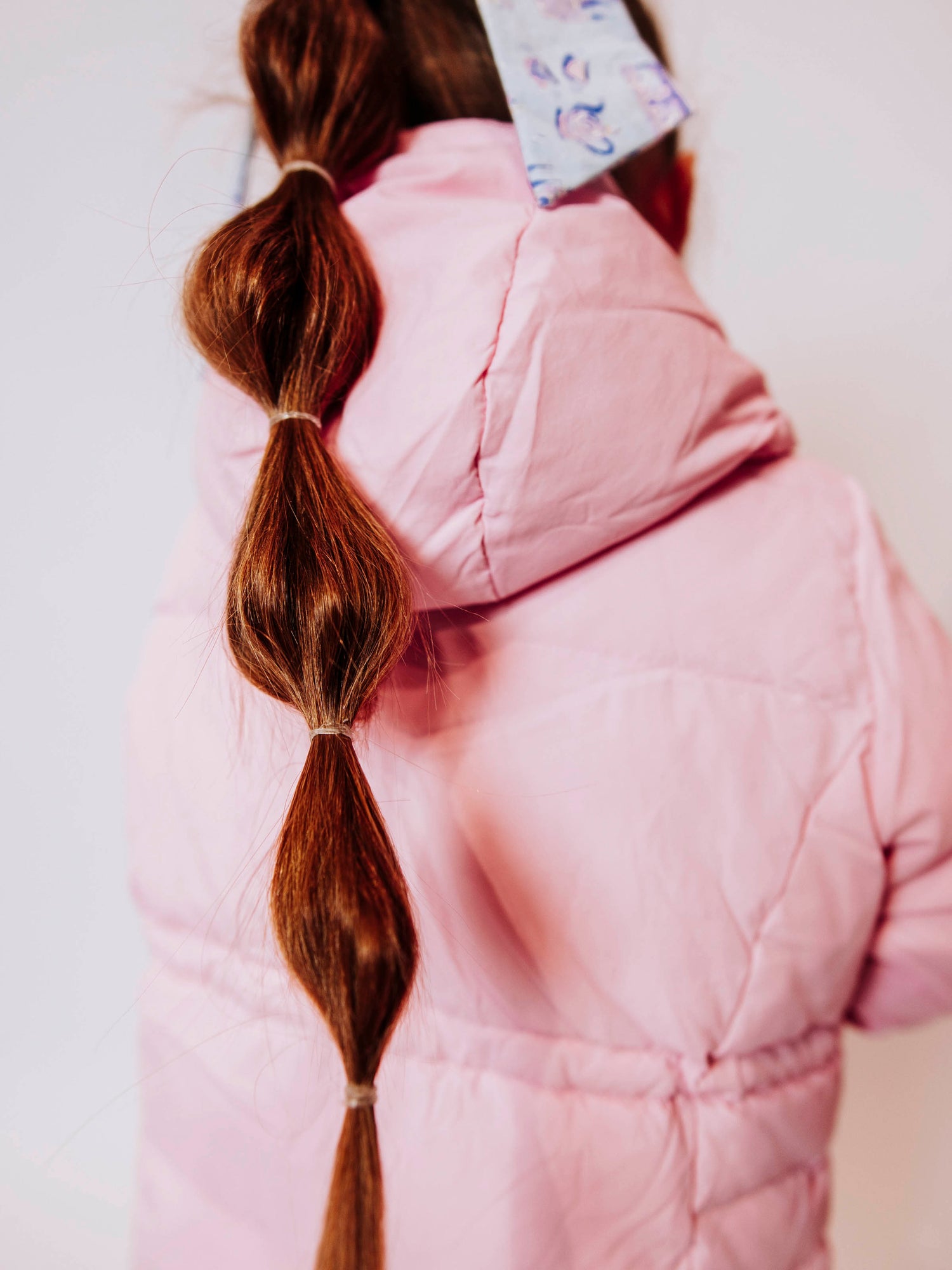 Keep her cozy and cute all season long in our Pink Puffer Jacket — the perfect blend of warmth and style! This soft, quilted jacket features a full zipper closure with a button placket, ensuring extra protection from chilly winds. Hidden front pockets keep little hands warm (or treasures tucked away), while the adjustable waist toggle allows for the perfect, comfortable fit. Designed in a beautiful blush pink hue, this girls’ puffer jacket pairs effortlessly with any winter outfit for a look that's fun!
