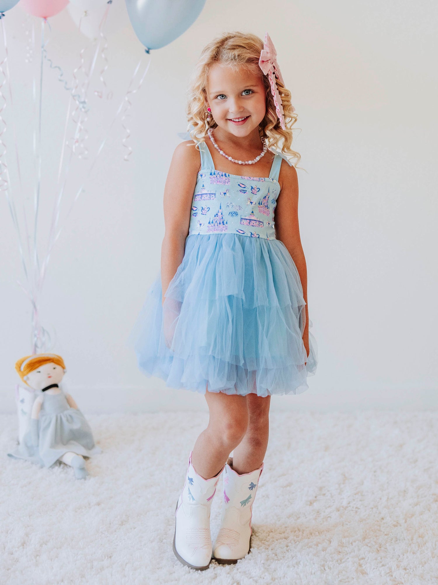 Bring a little fairytale sparkle to her wardrobe with our Most Magical Tulle Dress! Designed for twirls and make-believe moments, this enchanting girls’ dress features our whimsical Most Magical print on a soft, stretchy bodice paired with a full layered tulle skirt for the ultimate princess look. Perfect for birthdays, special occasions, or everyday play, it comfort and charm. Finished with delicate straps and a flowy silhouette, this dress makes every girl feel like she’s stepped into a fairytale!