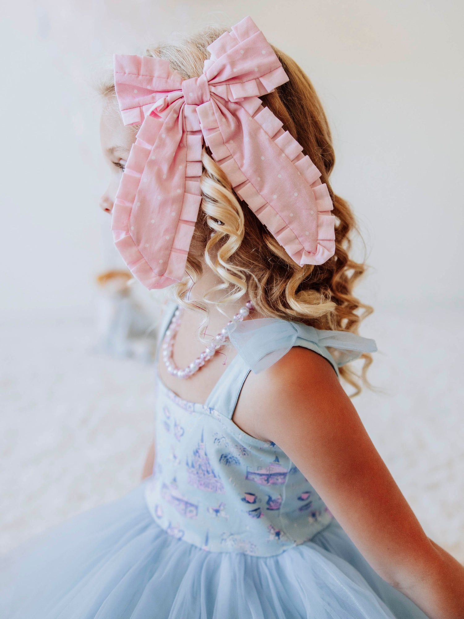 Add the perfect finishing touch to any outfit with our Pleated Bow! This classic girls’ hair bow features soft, textured pleats that create a timeless look for every occasion — from school days to special celebrations. Attached to a secure alligator clip, it stays perfectly in place through every twirl and playdate. Available in a variety of colors to match all her favorite SweetHoney styles, this bow is both stylish and sweet — a must-have accessory for every little girl’s wardrobe.
