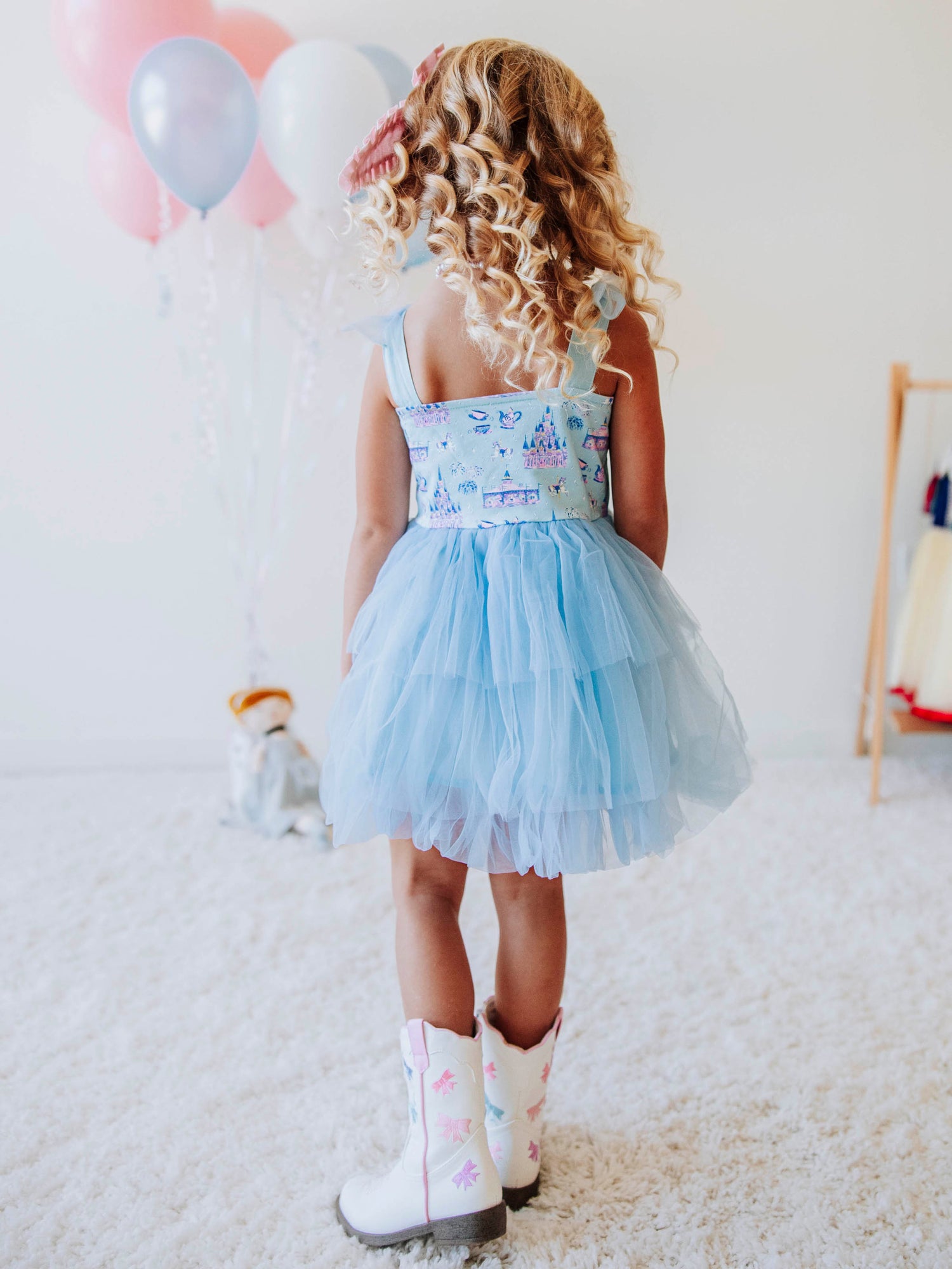 Bring a little fairytale sparkle to her wardrobe with our Most Magical Tulle Dress! Designed for twirls and make-believe moments, this enchanting girls’ dress features our whimsical Most Magical print on a soft, stretchy bodice paired with a full layered tulle skirt for the ultimate princess look. Perfect for birthdays, special occasions, or everyday play, it comfort and charm. Finished with delicate straps and a flowy silhouette, this dress makes every girl feel like she’s stepped into a fairytale!