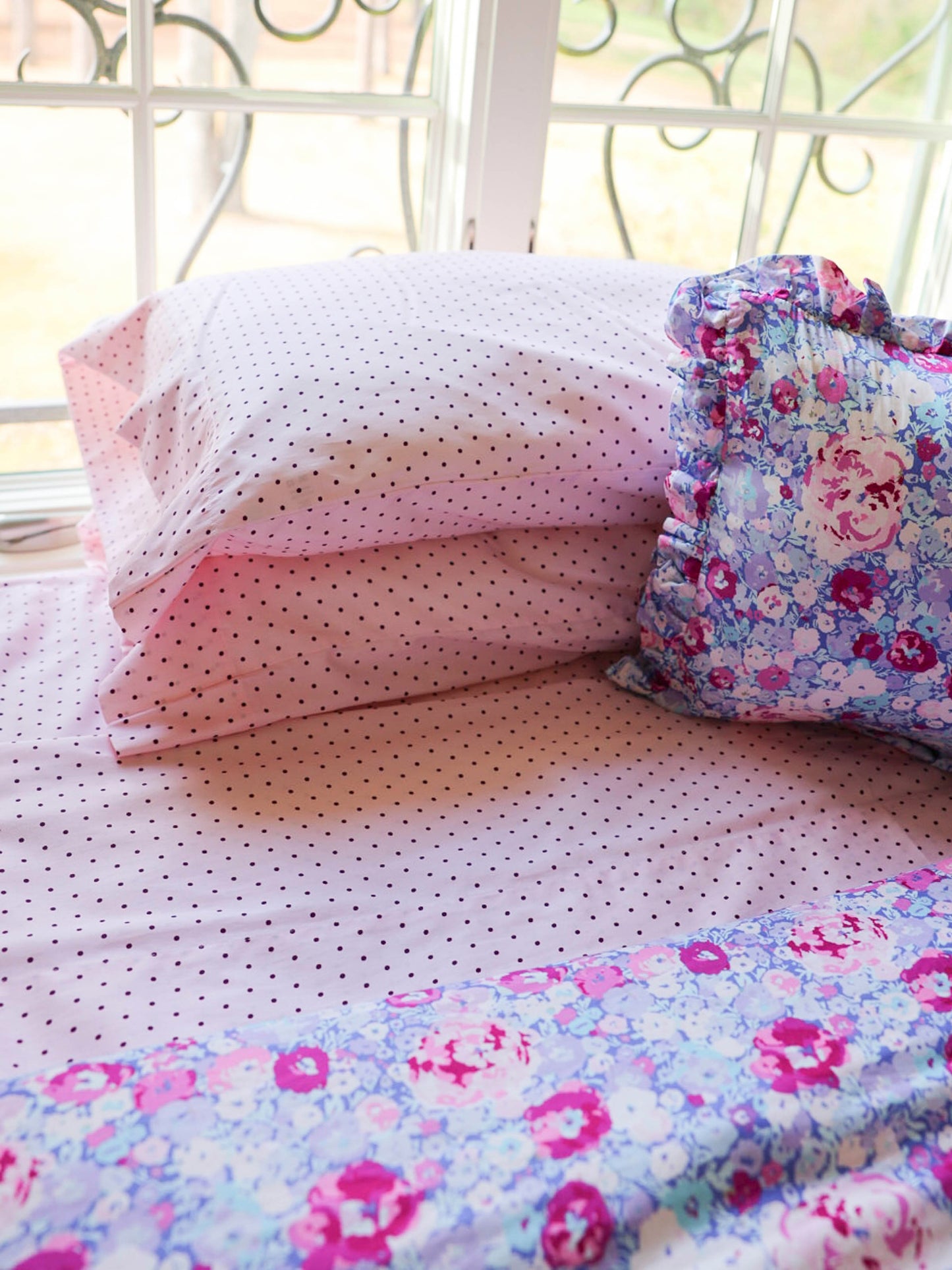 Brighten up any bedroom with our Pink Polka Dot Sheet Set, designed for sweetness, softness, and everyday comfort. Featuring a charming blush-pink base sprinkled with tiny, delicate polka dots, this set adds a playful yet polished touch to your child’s bedding. Crafted from smooth, breathable fabric, these sheets keep little sleepers cozy through every season. The lightweight weave offers a soft-to-the-touch feel, while the durable construction ensures long-lasting quality wash after wash. 