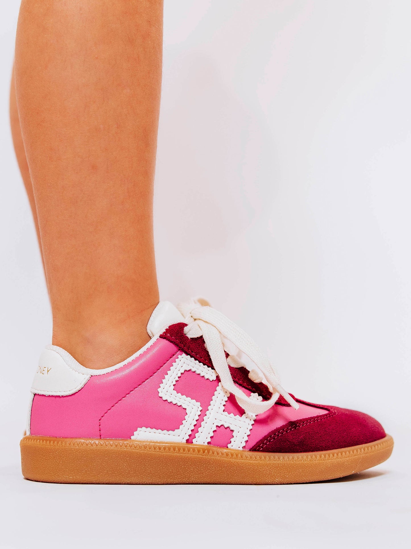 Step into style with our SweetHoney Signature Sneakers! Designed for comfort and play, these adorable girls’ sneakers feature a fun mix of pink and red tones with our signature “SH” SweetHoney logo for a bold, playful touch. Crafted with soft materials, sturdy soles, and easy lace-up styling, they’re perfect for school days, adventures, and everyday wear. Combining fashion and function, these sneakers are a must-have for every little trendsetter!