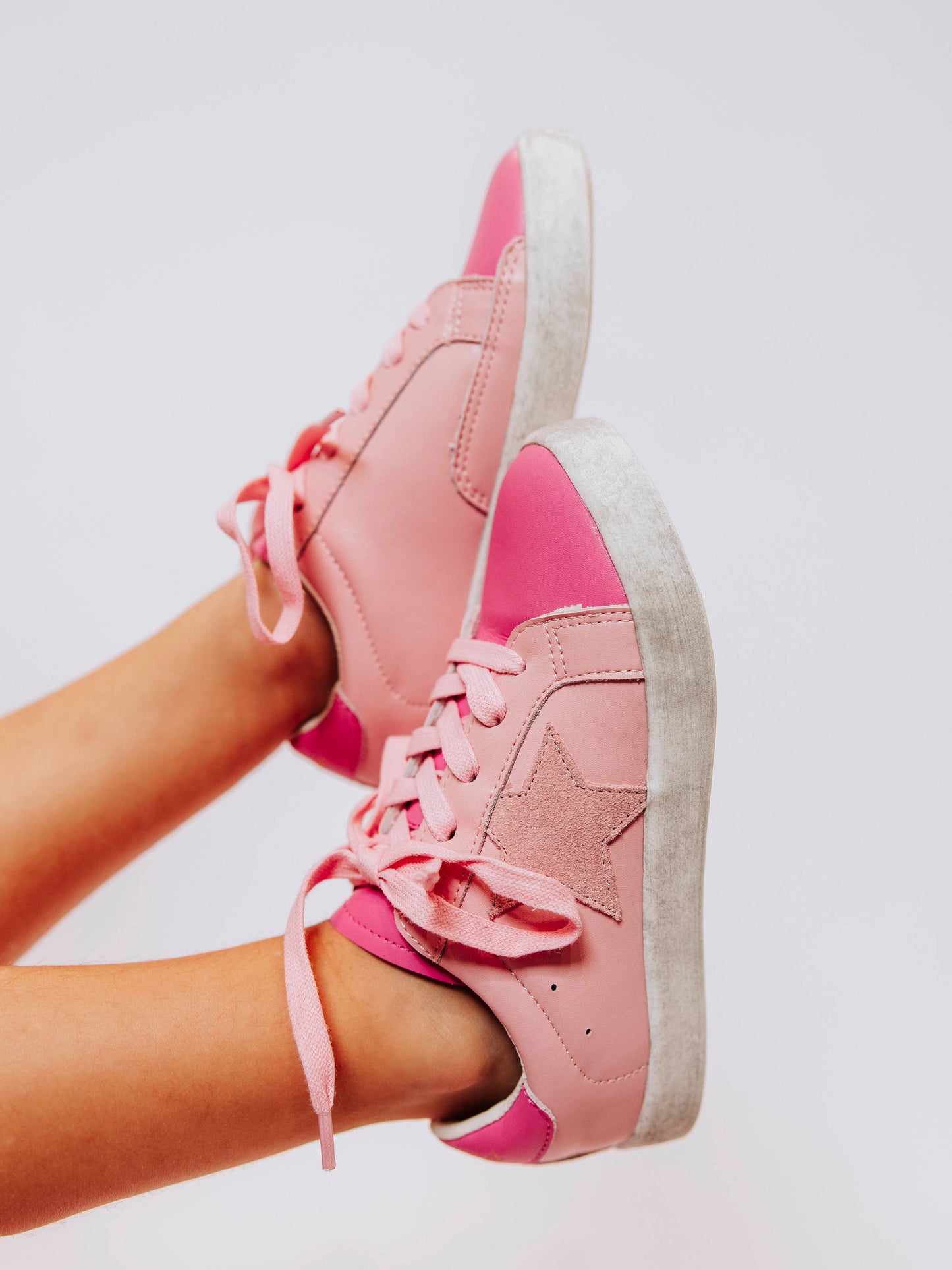 Step into sparkle and style with our SweetHoney Star Sneakers in pretty shades of pink! These boutique kids’ sneakers feature a glittery star detail, soft suede accents, and comfy rubber soles — perfect for playdates, school days, or twirling through the weekend. Designed for both comfort and cuteness, these girls pink sneakers add a touch of magic to every outfit while keeping little feet supported all day long.