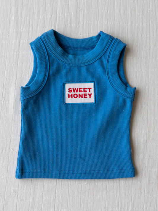 Sleeveless blue tank top with SweetHoney logo on chest