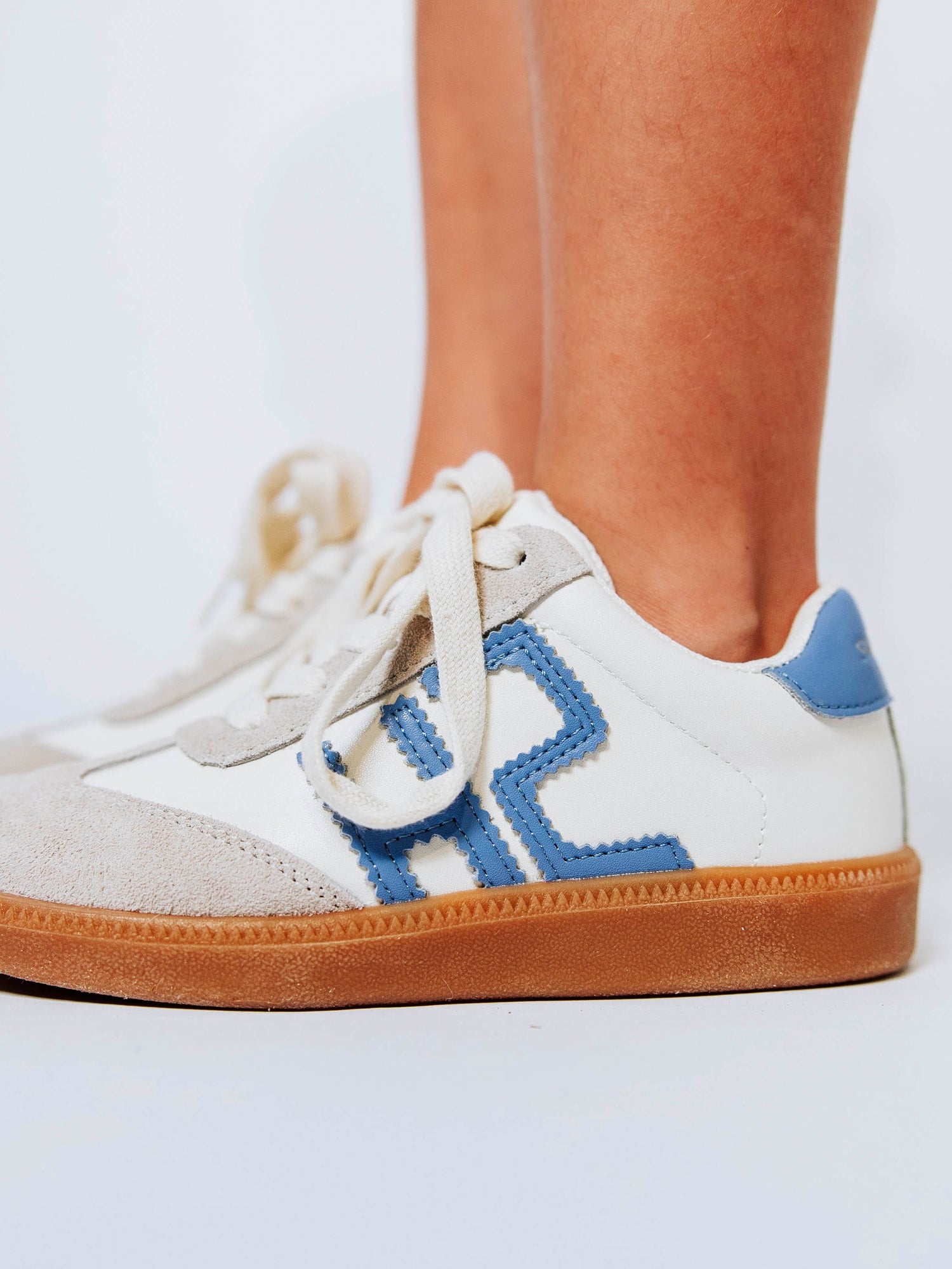 Fresh, fun, and full of SweetHoney style — our Signature Sneakers in dusty blue and white are the perfect mix of comfort and charm! Featuring our bold “SH” SweetHoney logo, soft suede accents, and durable gum soles, these boutique kids’ sneakers are designed for everyday adventures. Whether paired with twirl dresses or playtime outfits, they’re the ultimate blend of fashion and function for little trendsetters on the go.