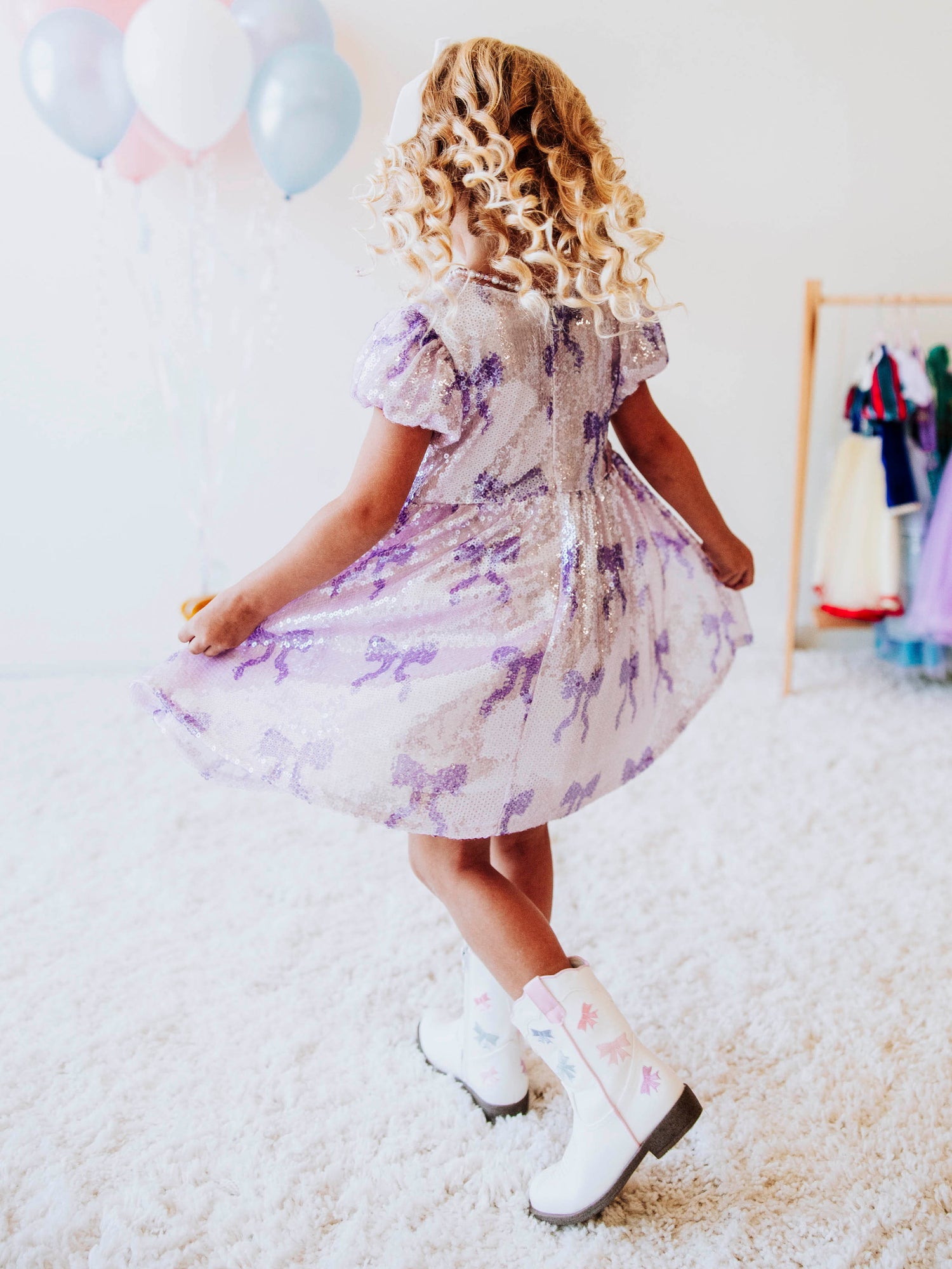 Let her sparkle and shine in our Lavender Sequin Bow Dress, a dazzling piece made for twirls, parties, and magical memories! Designed with shimmering lavender sequins and dainty bow details throughout, this girls’ sequin party dress captures the perfect mix of sweetness and sparkle.
The soft interior lining keeps her comfortable, while the puff sleeves and gathered skirt add a touch of classic charm. Perfect party dress, holiday dress and sparkle dress for any occasion! 