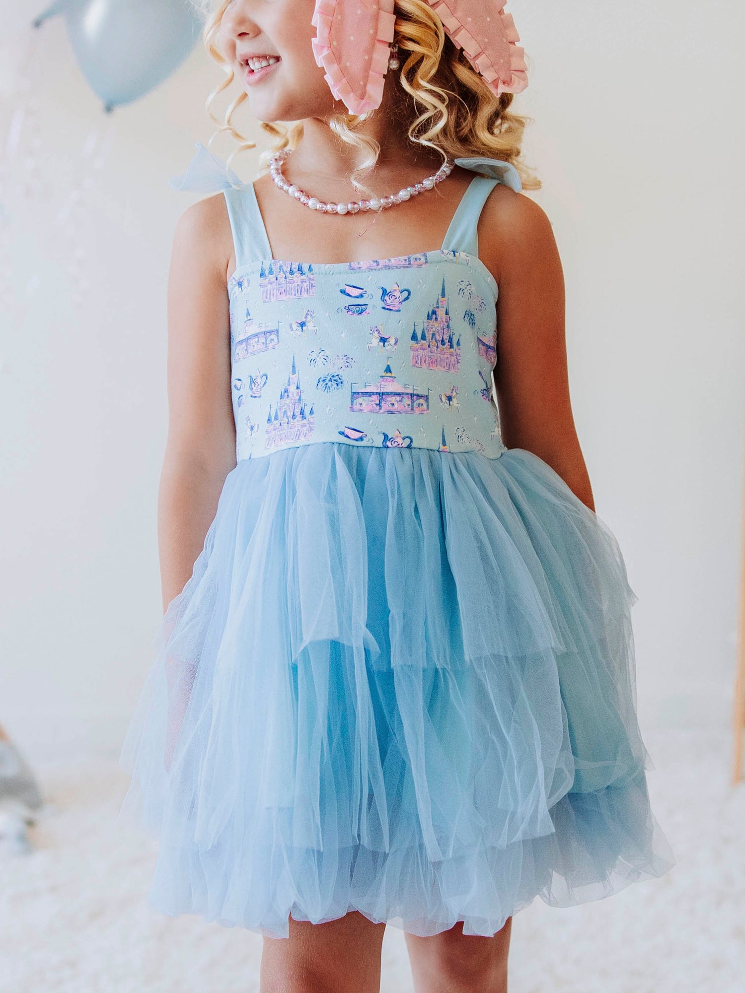 Bring a little fairytale sparkle to her wardrobe with our Most Magical Tulle Dress! Designed for twirls and make-believe moments, this enchanting girls’ dress features our whimsical Most Magical print on a soft, stretchy bodice paired with a full layered tulle skirt for the ultimate princess look. Perfect for birthdays, special occasions, or everyday play, it comfort and charm. Finished with delicate straps and a flowy silhouette, this dress makes every girl feel like she’s stepped into a fairytale!