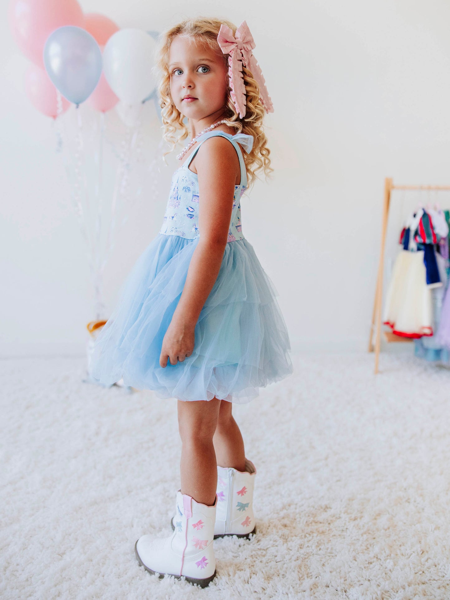 Bring a little fairytale sparkle to her wardrobe with our Most Magical Tulle Dress! Designed for twirls and make-believe moments, this enchanting girls’ dress features our whimsical Most Magical print on a soft, stretchy bodice paired with a full layered tulle skirt for the ultimate princess look. Perfect for birthdays, special occasions, or everyday play, it comfort and charm. Finished with delicate straps and a flowy silhouette, this dress makes every girl feel like she’s stepped into a fairytale!