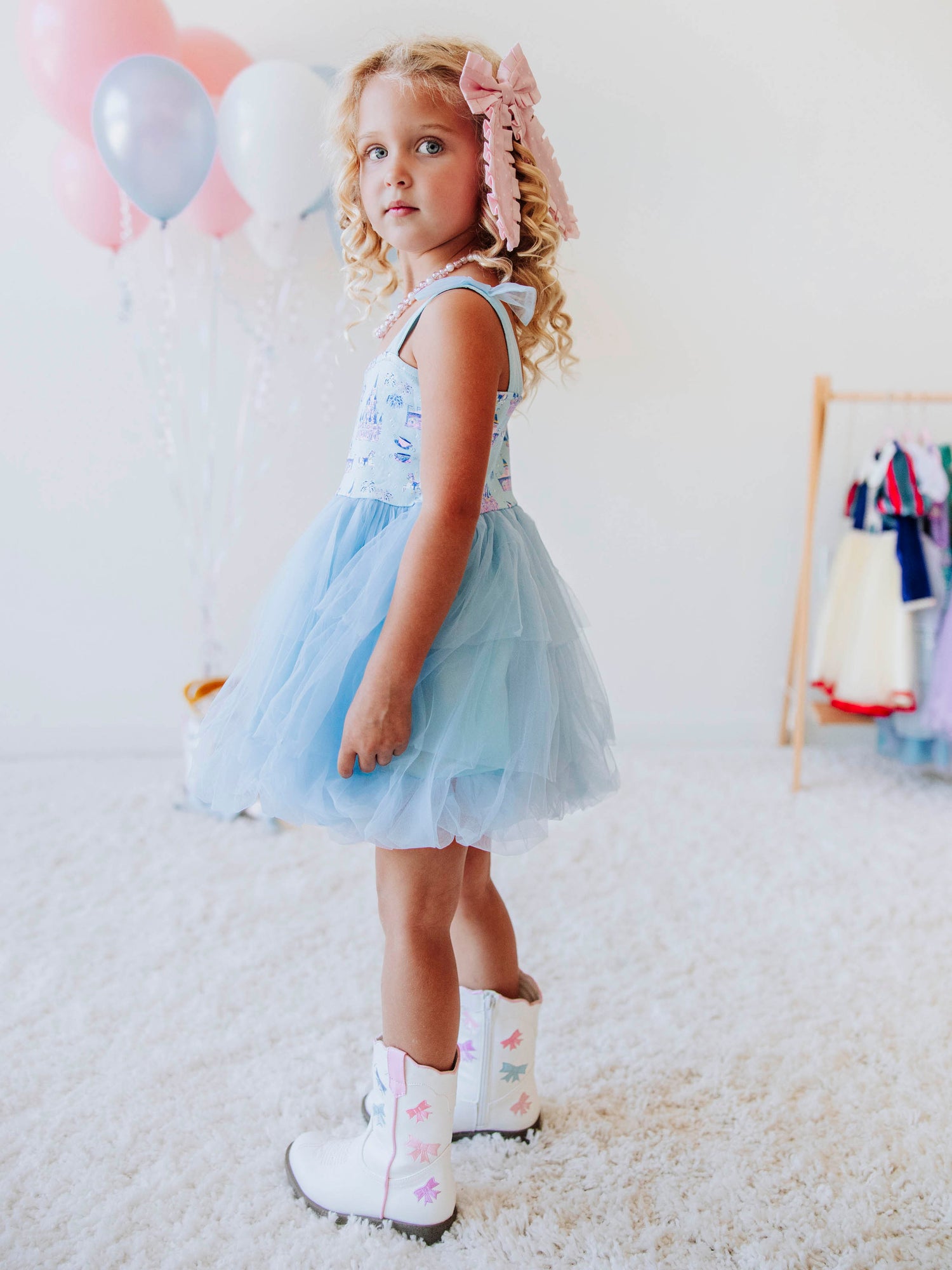 Bring a little fairytale sparkle to her wardrobe with our Most Magical Tulle Dress! Designed for twirls and make-believe moments, this enchanting girls’ dress features our whimsical Most Magical print on a soft, stretchy bodice paired with a full layered tulle skirt for the ultimate princess look. Perfect for birthdays, special occasions, or everyday play, it comfort and charm. Finished with delicate straps and a flowy silhouette, this dress makes every girl feel like she’s stepped into a fairytale!