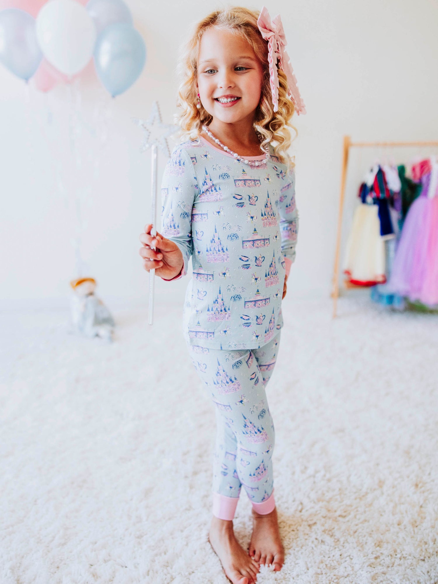 Drift off to dreamland in our “Most Magical” fitted two-piece pajamas, featuring a whimsical print filled with sparkling castles, carousels, and fairy-tale fun. Made from ultra-soft, stretchy fabric, these girls’ pajamas are designed for cozy comfort and a snug fit that stays put all night long. Perfect for little dreamers who love all things magical, these cotton-blend PJs make bedtime feel like a fairytale adventure.