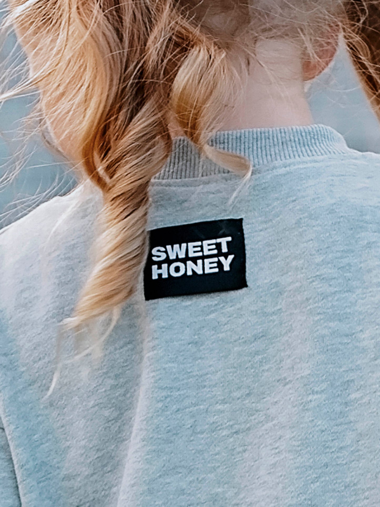Close -up of SWEETHONEY logo tag